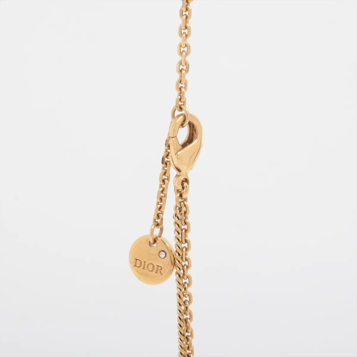 Petit CD necklace, gold plated with rhinestones. Shows signs of wear including dents, — view 3