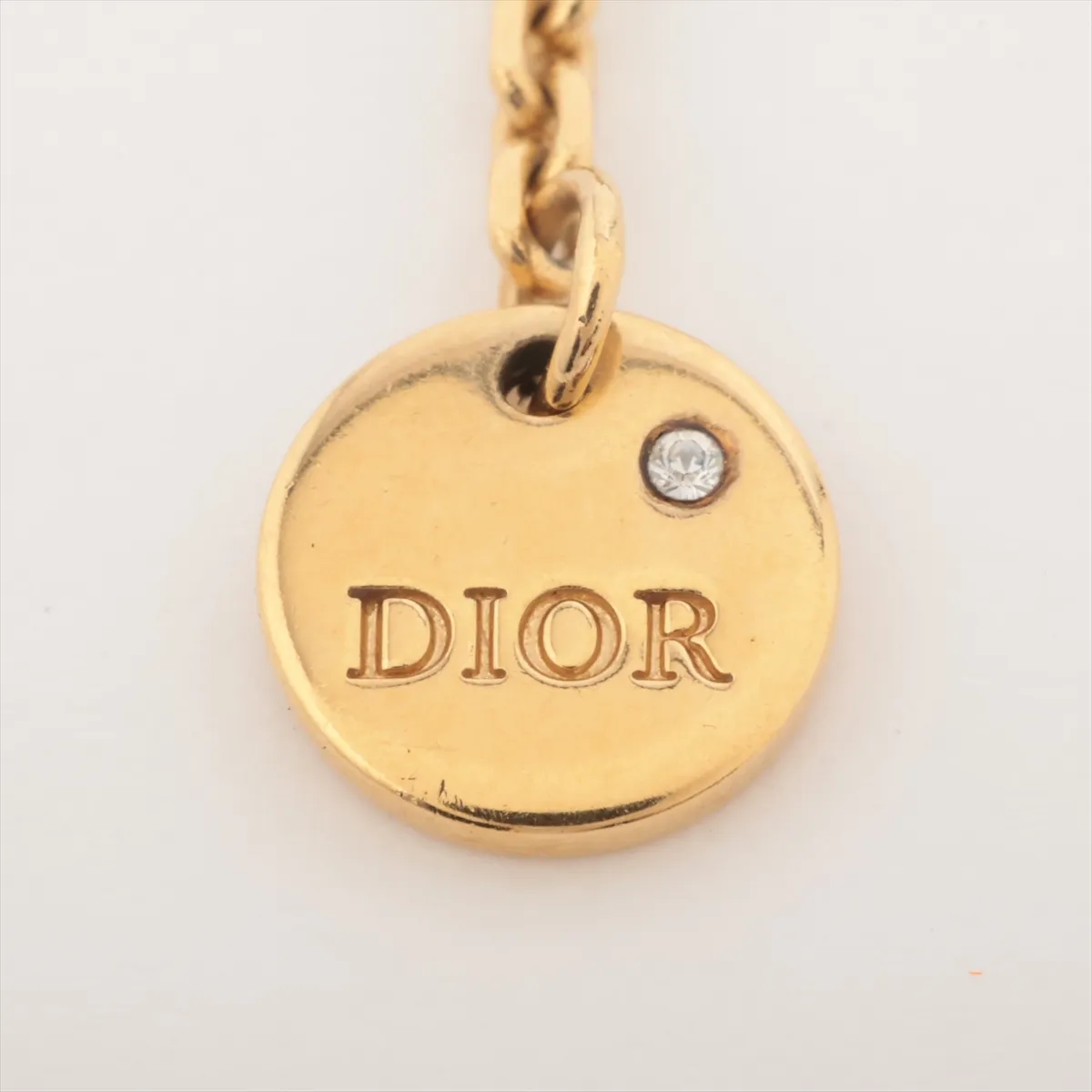 Petit CD necklace, gold plated with rhinestones. Shows signs of wear including dents, — view 4