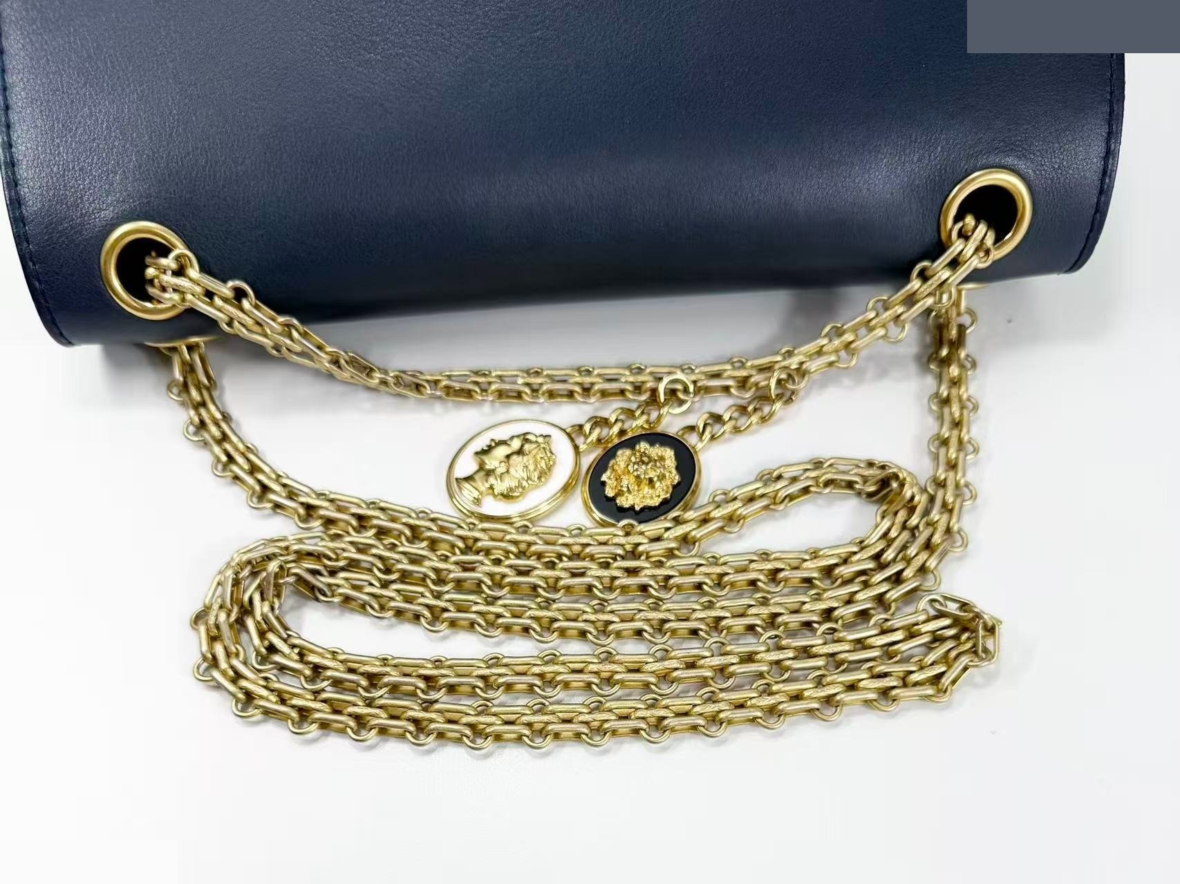 2.55 Double flap shoulder bag with medal charm, approximately 25cm wide, serial number in the 23 range. — view 4
