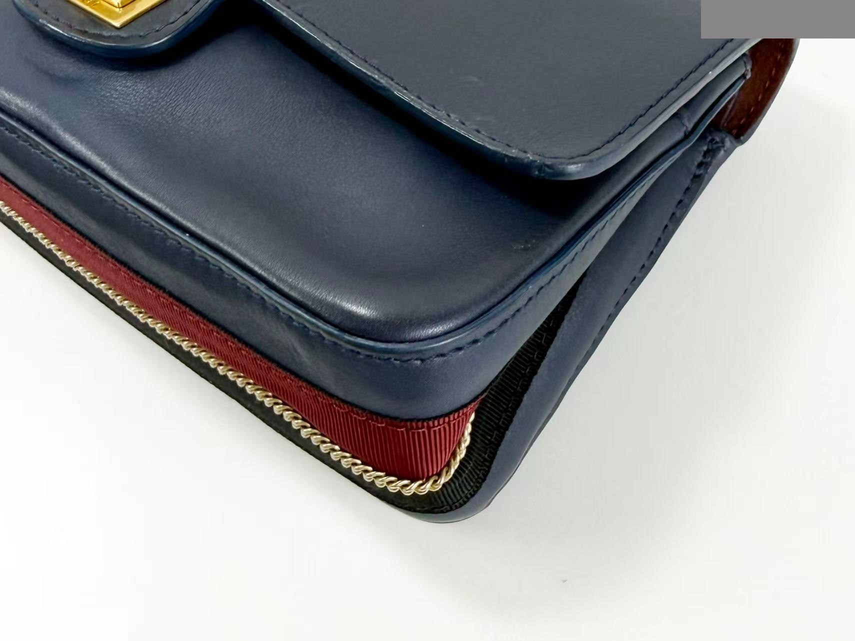 2.55 Double flap shoulder bag with medal charm, approximately 25cm wide, serial number in the 23 range. — view 7