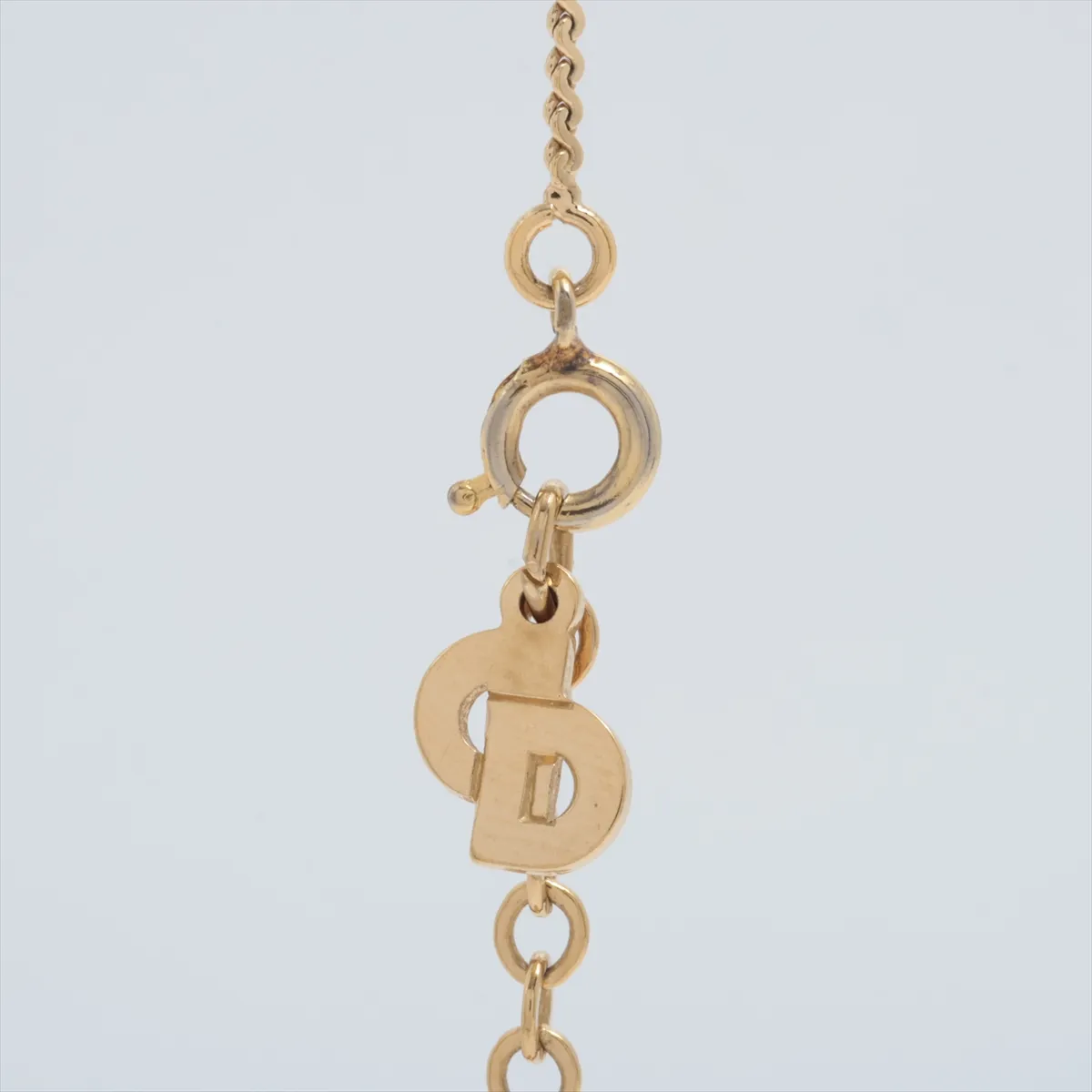 CD logo necklace, gold plated with rhinestones. Features include — view 3