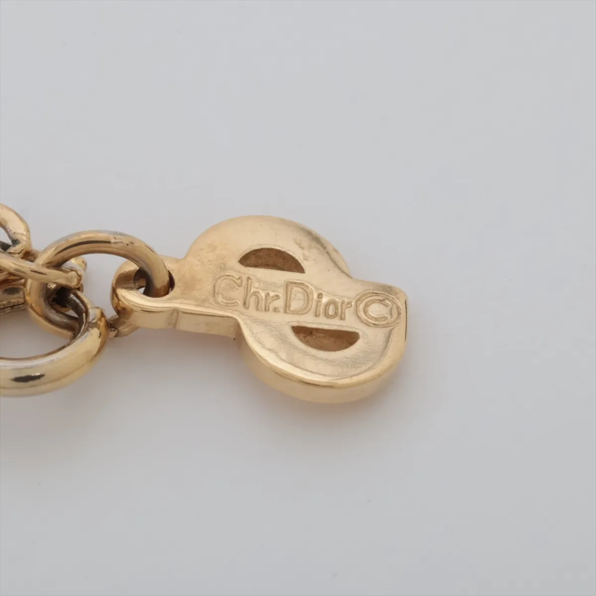 CD logo necklace, gold plated with rhinestones. Features include — view 4