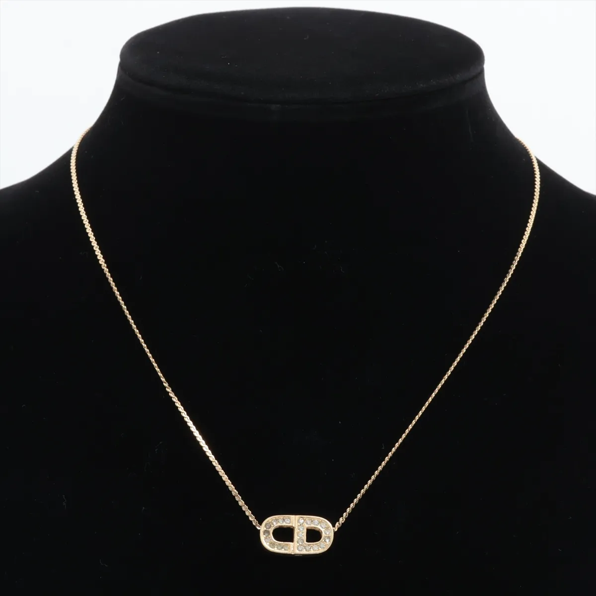 CD logo necklace, gold plated with rhinestones. Features include — view 5