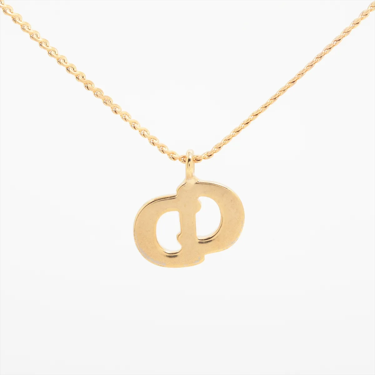 CD logo necklace, gold plated with rhinestones. Shows signs of wear, — view 2