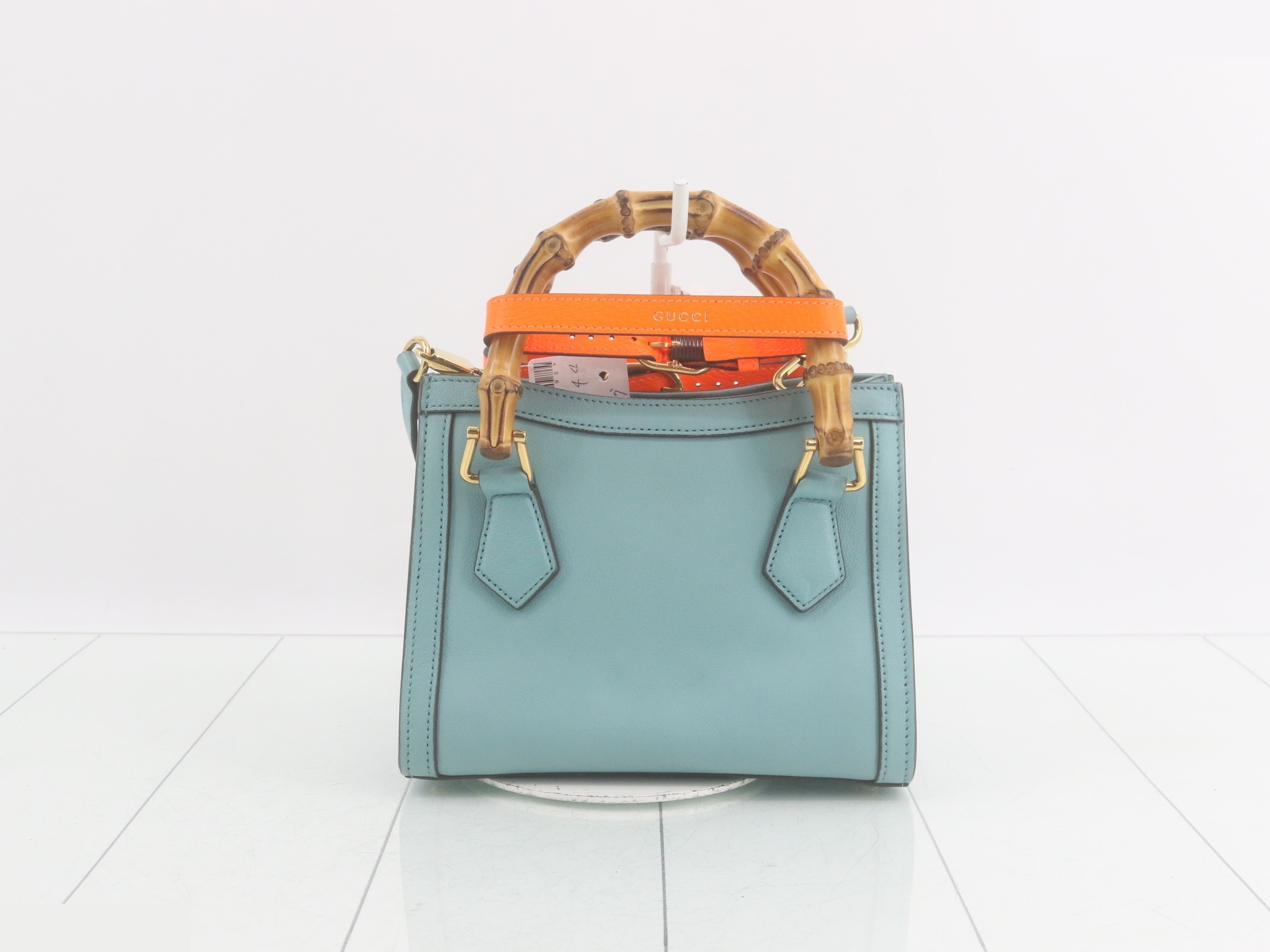 Leather and bamboo mini handbag with shoulder strap, available in blue and orange. — view 2