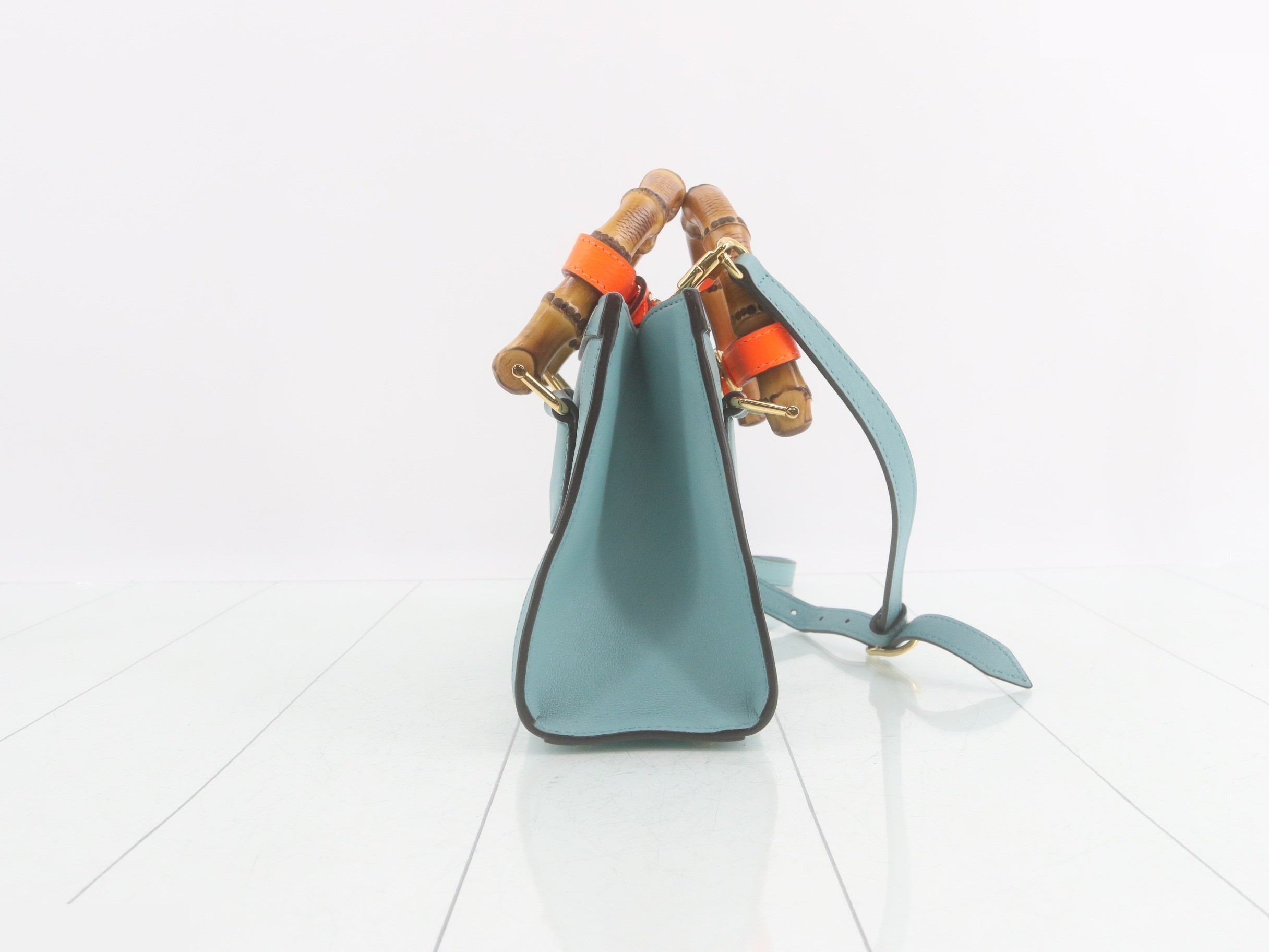 Leather and bamboo mini handbag with shoulder strap, available in blue and orange. — view 4