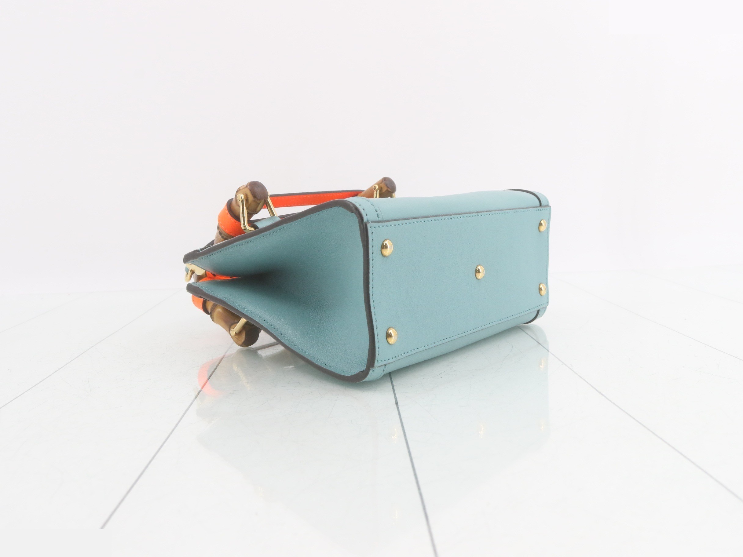 Leather and bamboo mini handbag with shoulder strap, available in blue and orange. — view 5