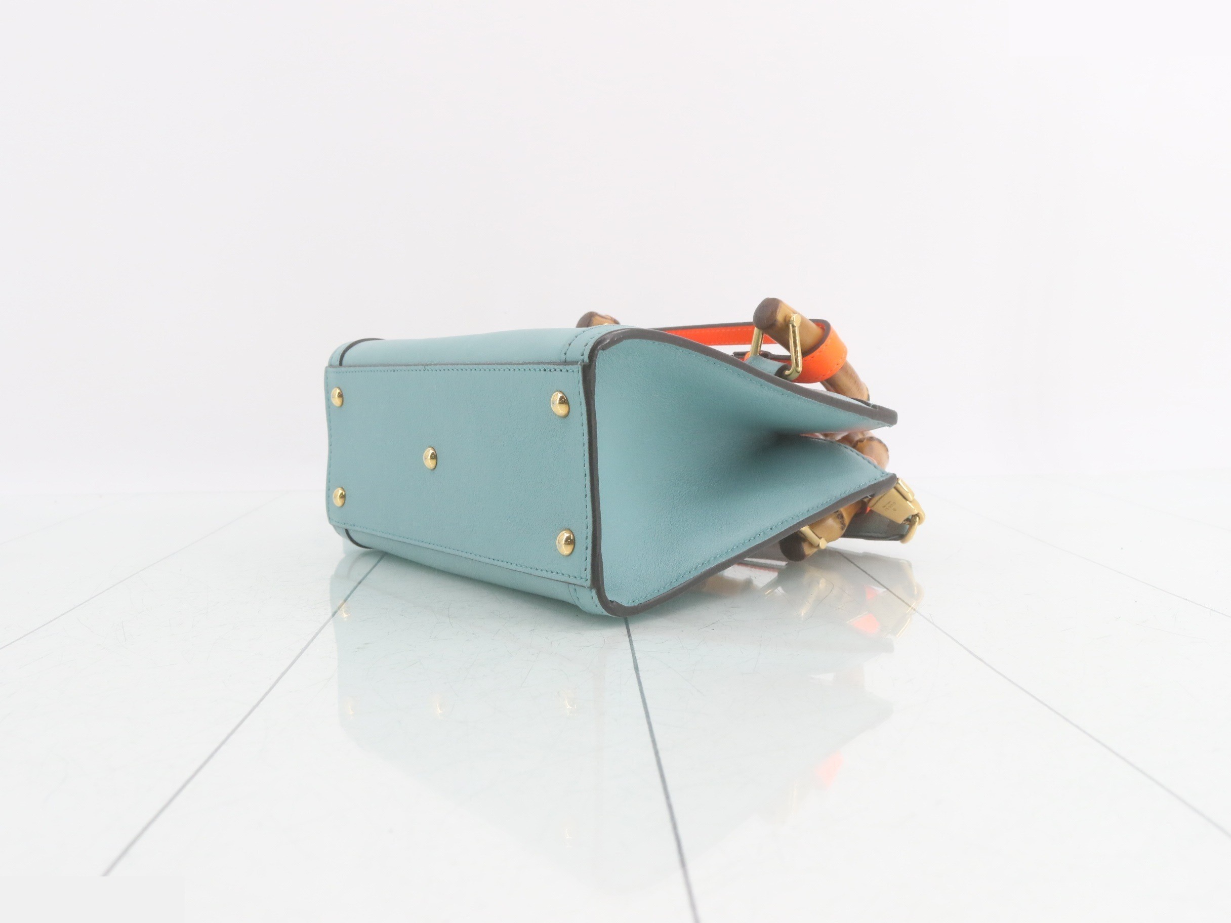Leather and bamboo mini handbag with shoulder strap, available in blue and orange. — view 6