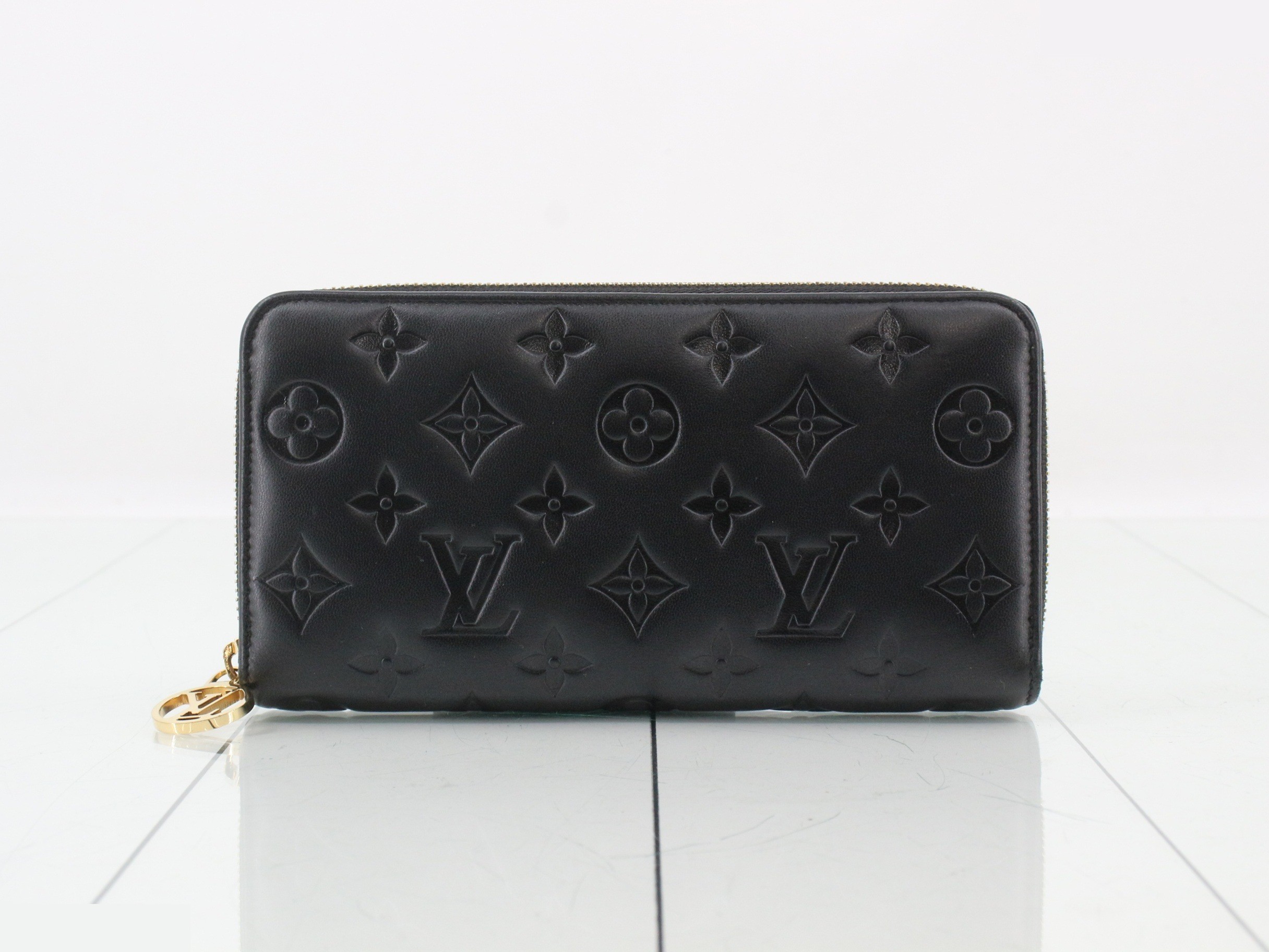 LV Monogram Embossed Zippy Wallet