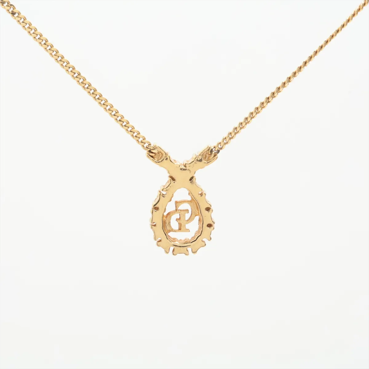 CD logo necklace, gold plated with rhinestones. Shows signs of wear, including — view 2