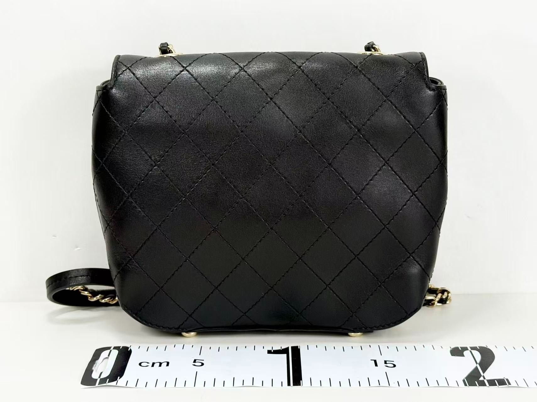 Black Matelassé Tanlock Shoulder Bag, approximately 20cm wide, serial number in the 27 range. — view 3