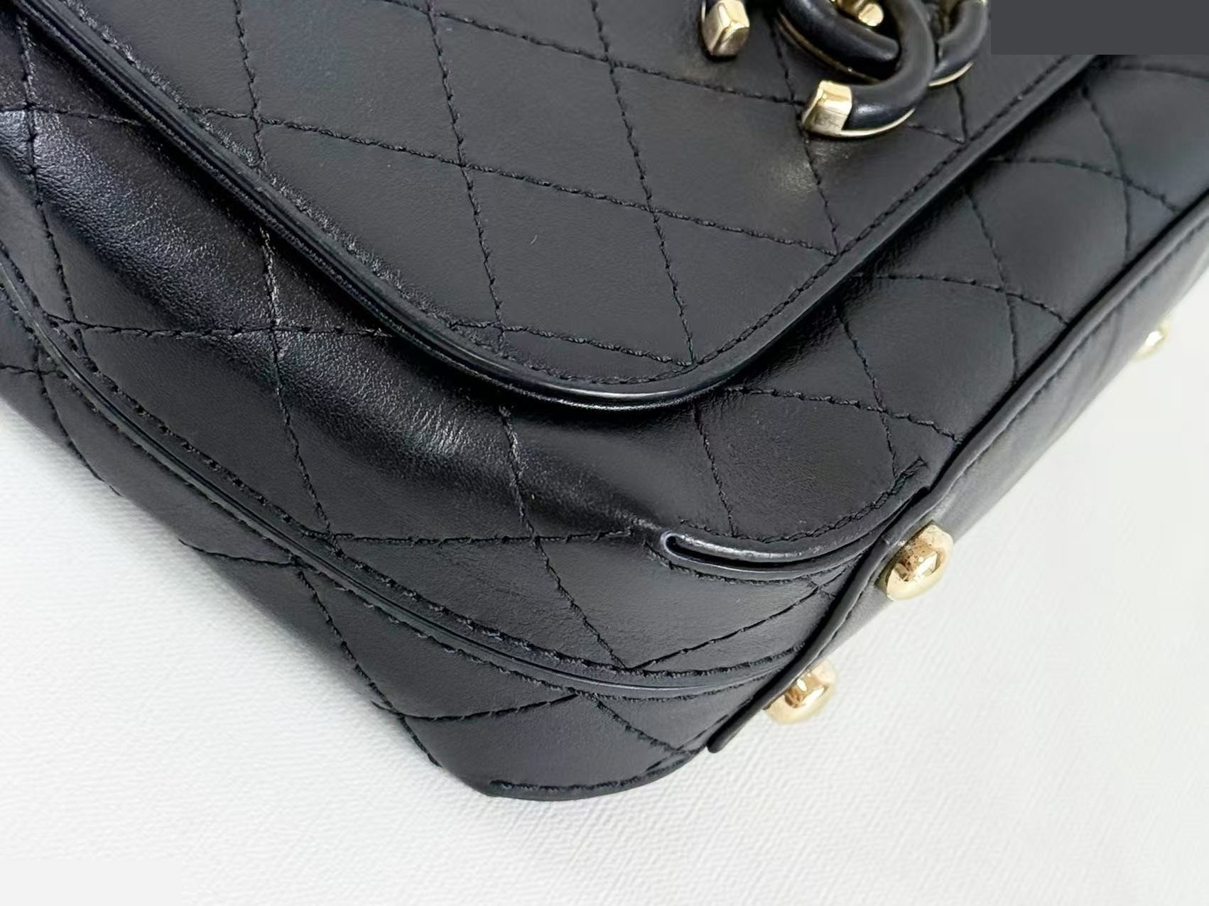Black Matelassé Tanlock Shoulder Bag, approximately 20cm wide, serial number in the 27 range. — view 5