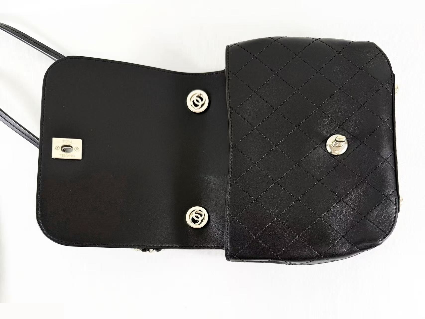 Black Matelassé Tanlock Shoulder Bag, approximately 20cm wide, serial number in the 27 range. — view 8
