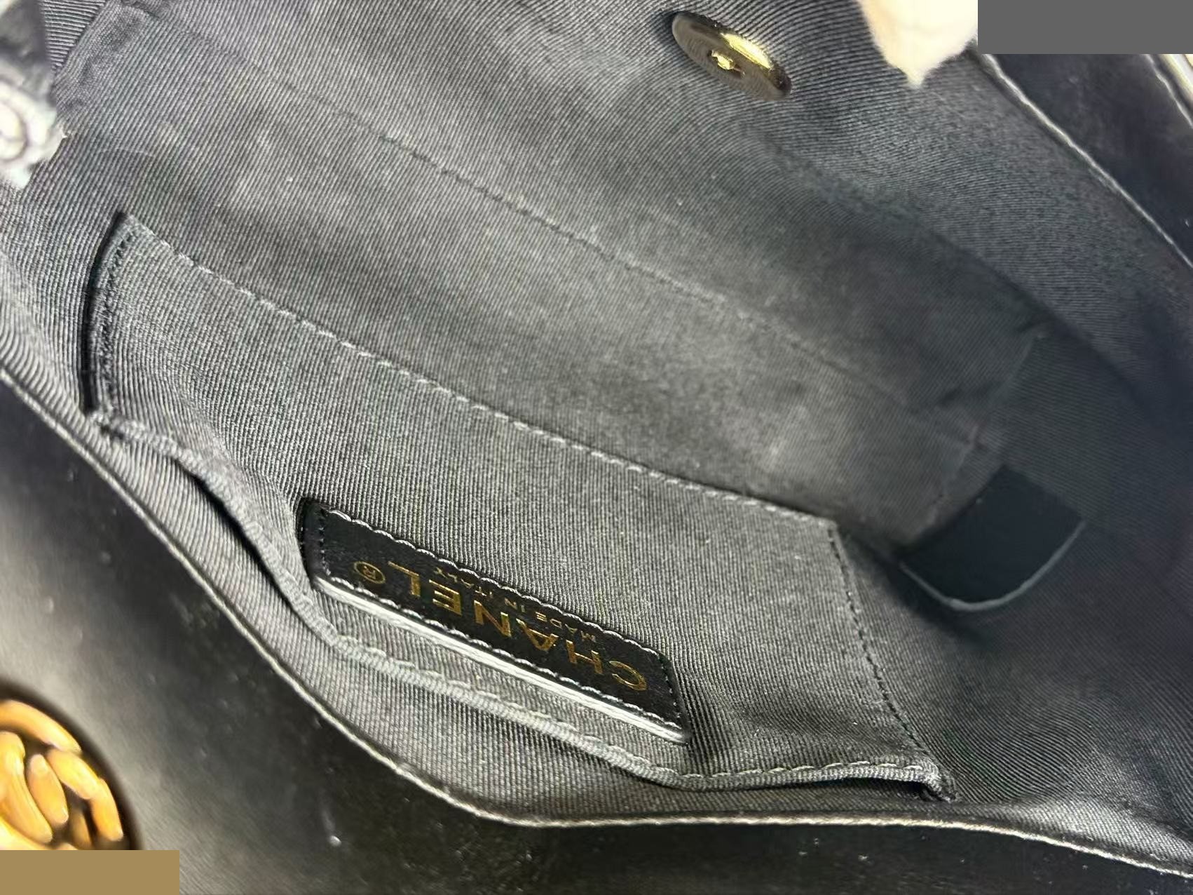 Black Matelassé Tanlock Shoulder Bag, approximately 20cm wide, serial number in the 27 range. — view 10