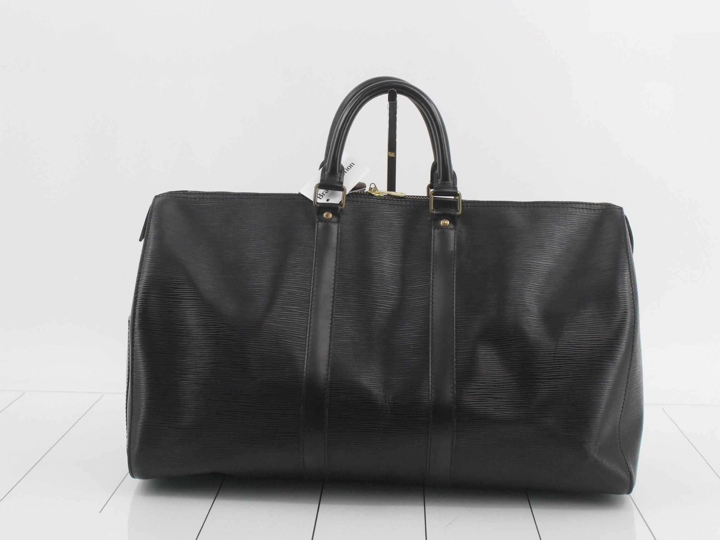Keepall 45 Noir (Black) with padlock, name tag, and handle strap. — view 2