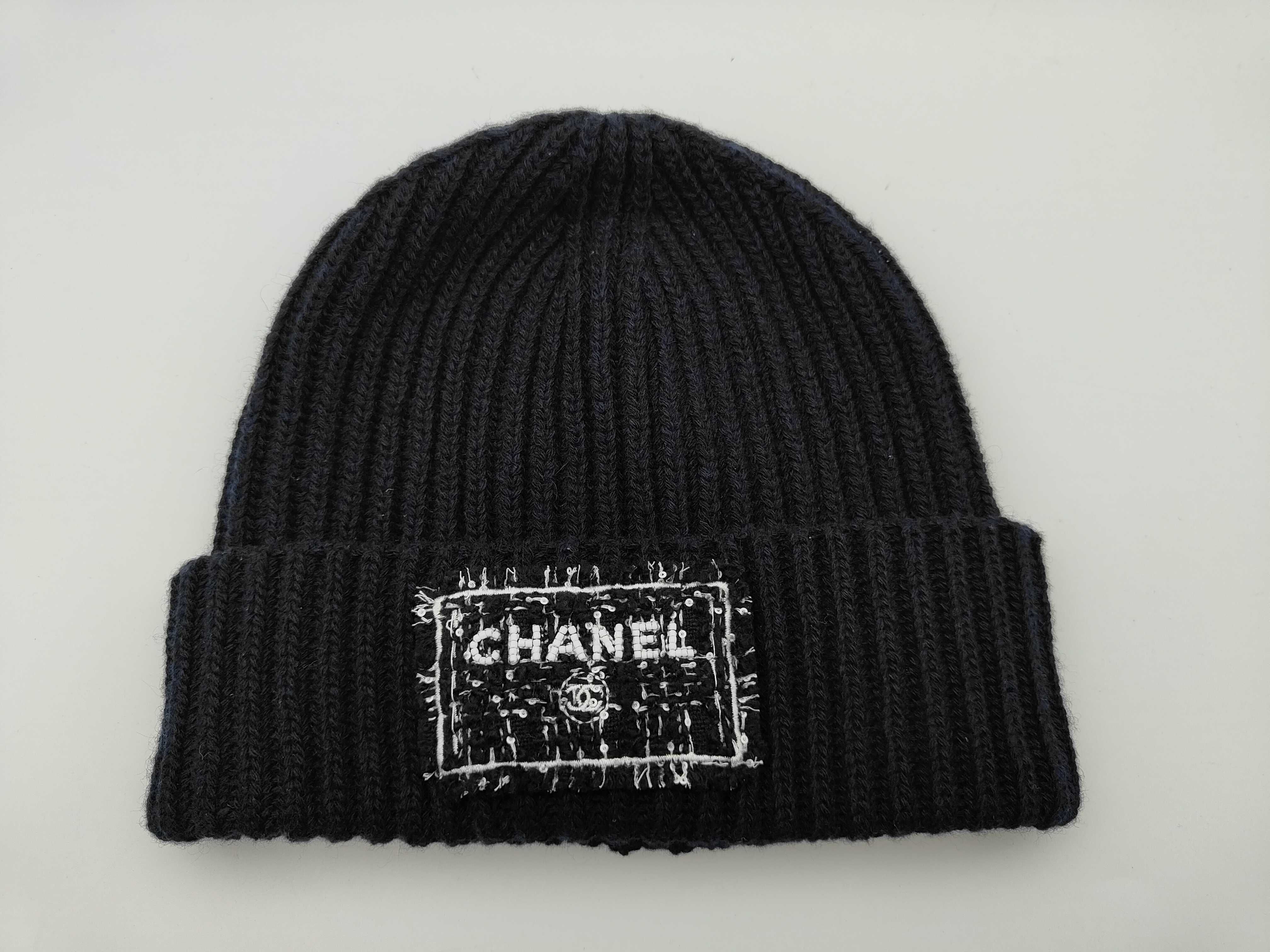 knitted hat with jeweled logo, black cashmere, other accessories.