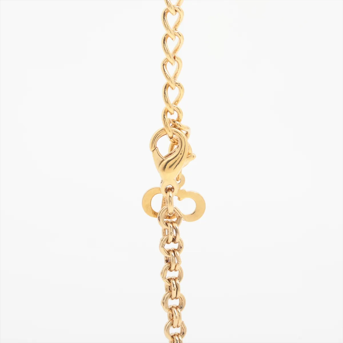 CD logo necklace, gold plated with rhinestones. Shows signs of wear, including — view 3