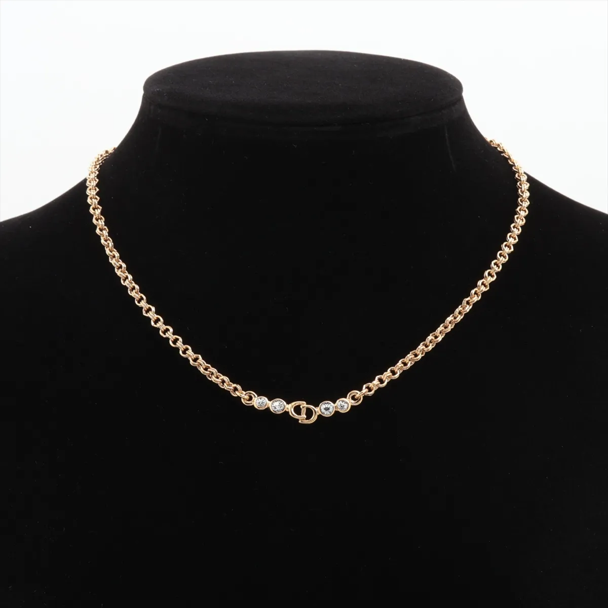 CD logo necklace, gold plated with rhinestones. Shows signs of wear, including — view 5
