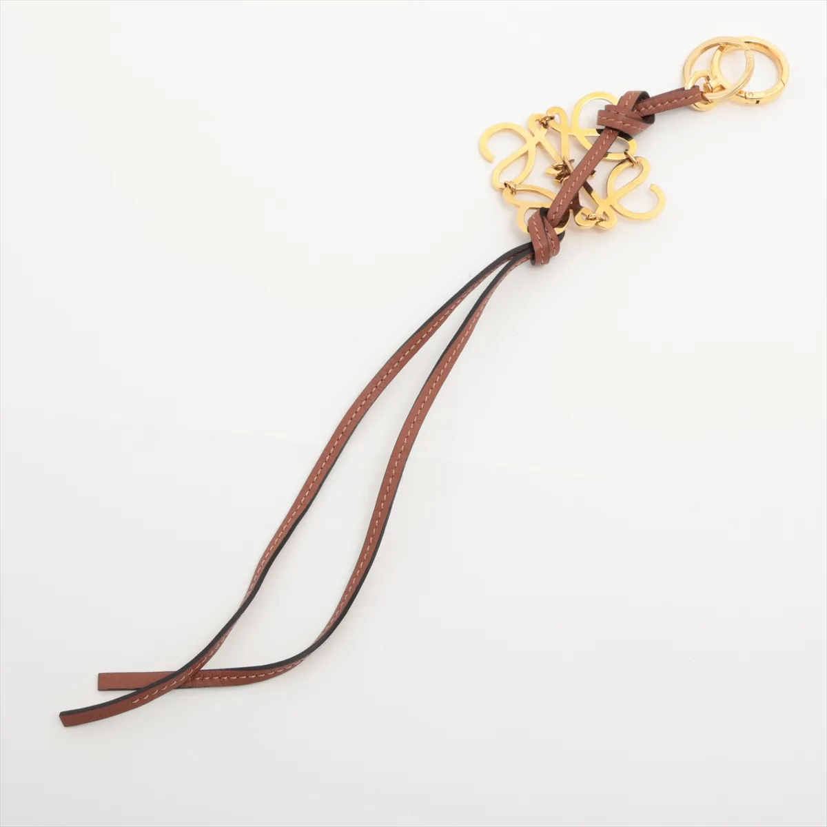 Anagram Charm, Leather x GP, Brown. Shows signs of wear, — view 2
