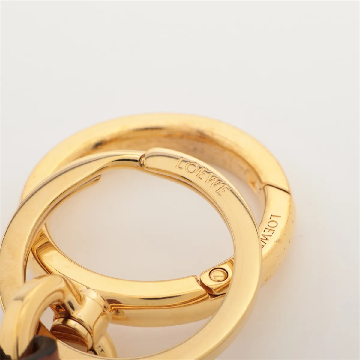 Anagram Charm, Leather x GP, Brown. Shows signs of wear, — view 3