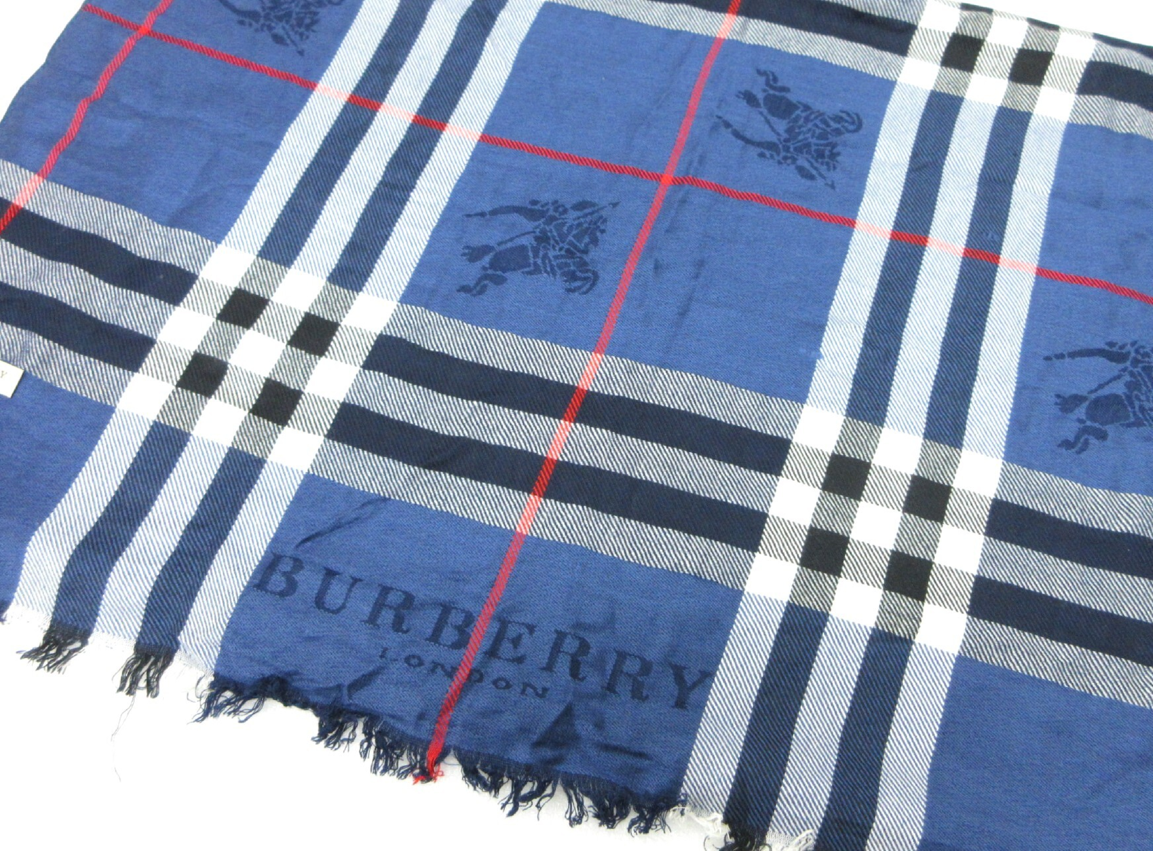 LONDON Burberry check scarf, blue tones, and other accessories.