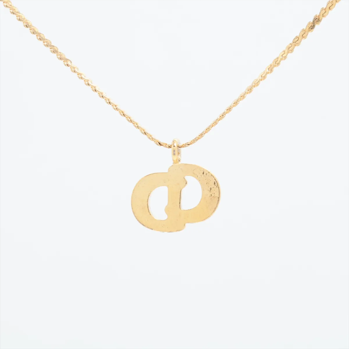 CD logo necklace, gold plated with rhinestones. Shows signs of wear, — view 2