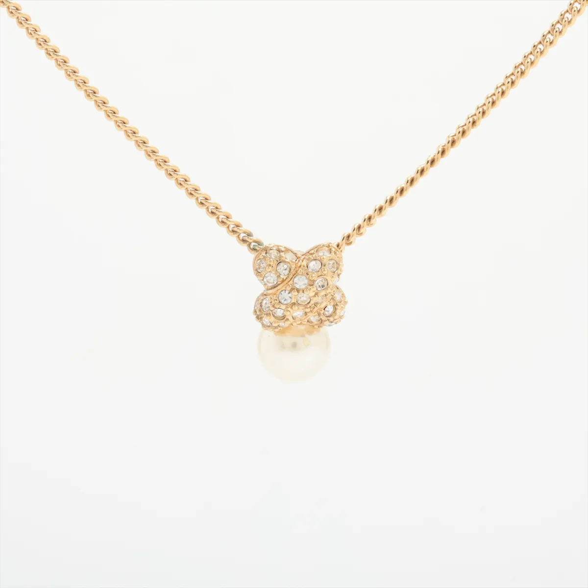 necklace, gold plated, rhinestones, and faux pearls. Shows signs of wear, including