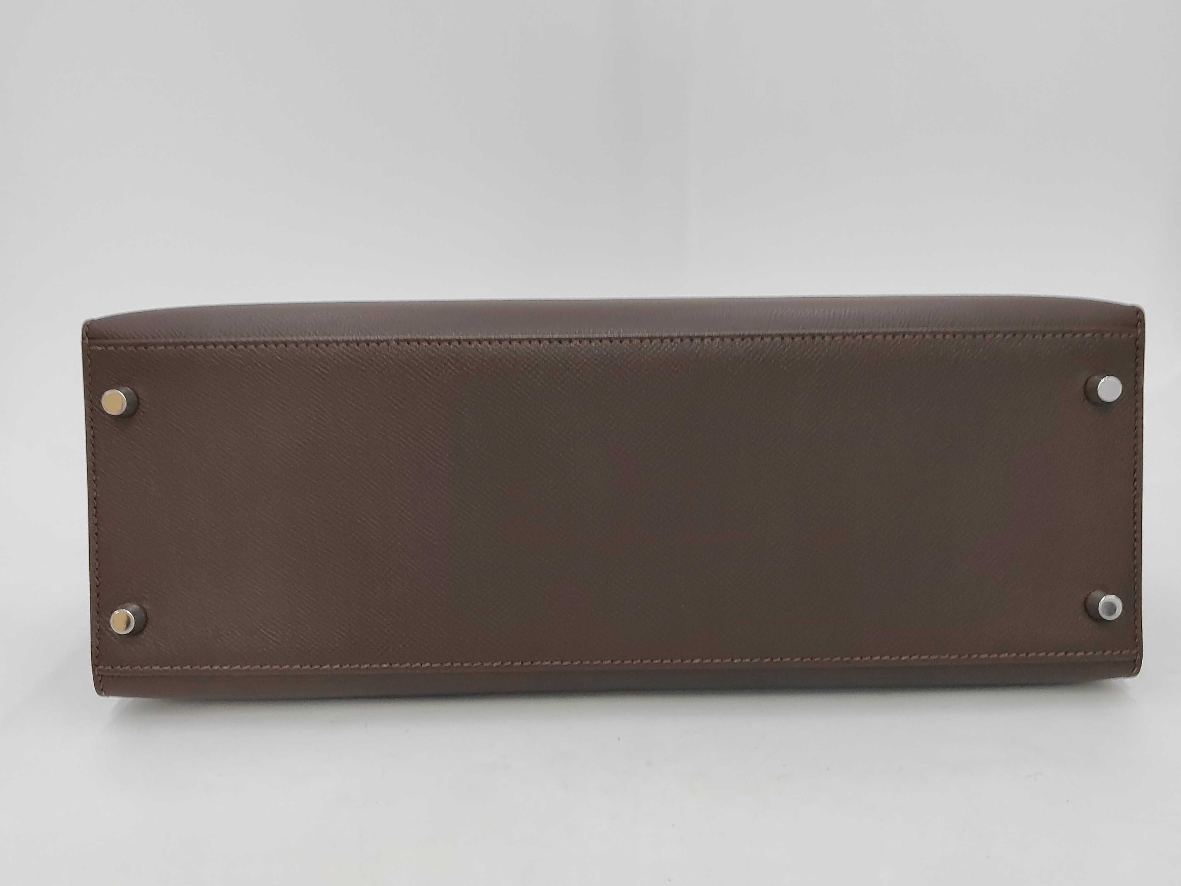 Kelly 35, 2-way bag, Epsom leather, dark brown, silver hardware, N stamp, includes dust bag, strap, rain cover, clochette, key, and 2 keys. 35x25x13cm, shoulder strap approx. 9cm. Handbag. — view 6