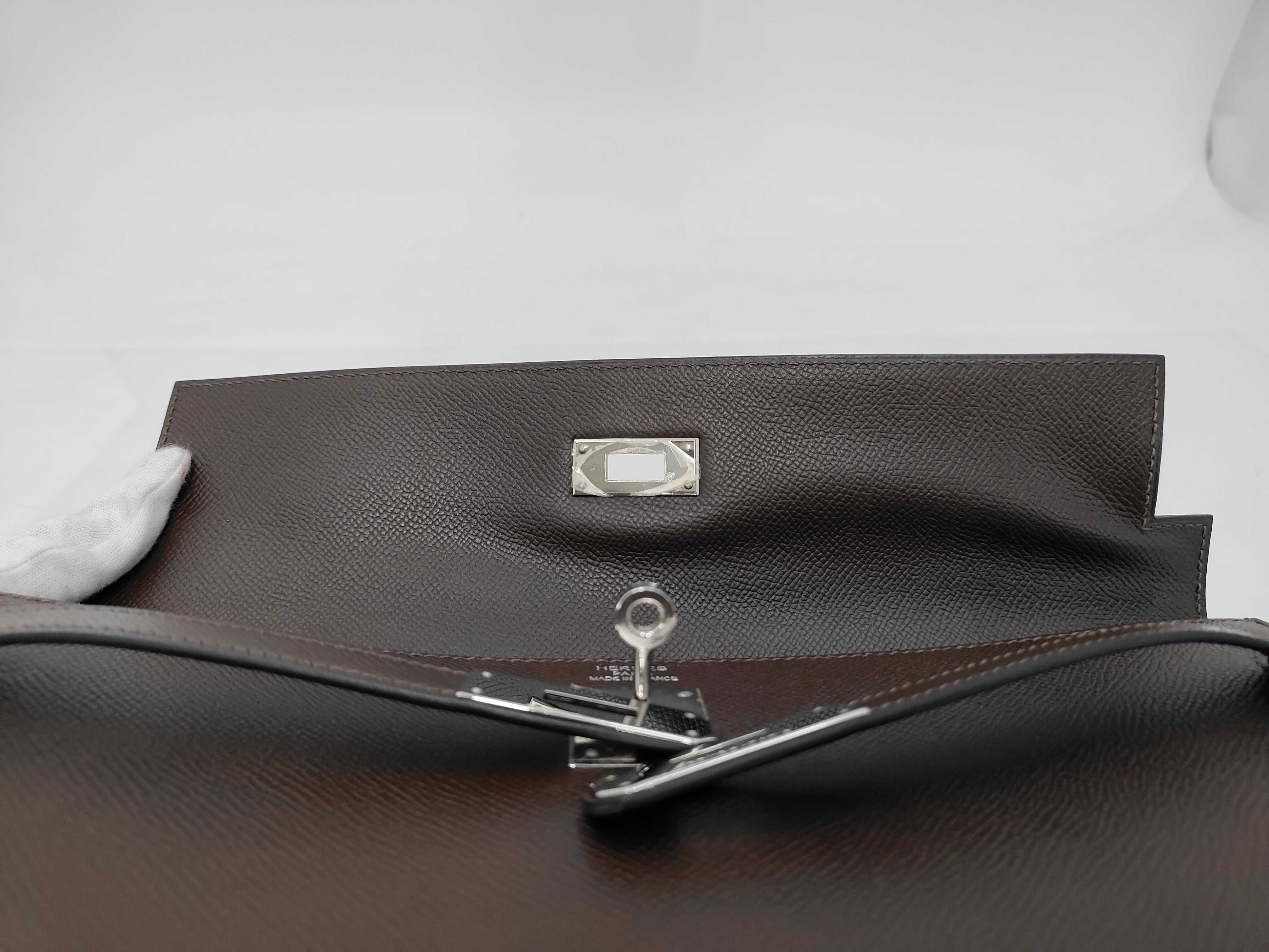 Kelly 35, 2-way bag, Epsom leather, dark brown, silver hardware, N stamp, includes dust bag, strap, rain cover, clochette, key, and 2 keys. 35x25x13cm, shoulder strap approx. 9cm. Handbag. — view 8
