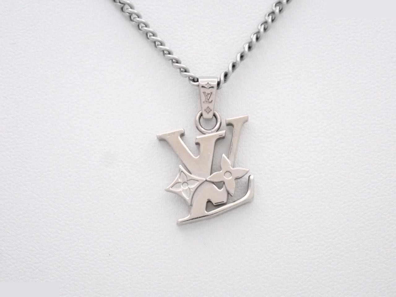 Monogram Row pendant ring; chain approximately 54cm.