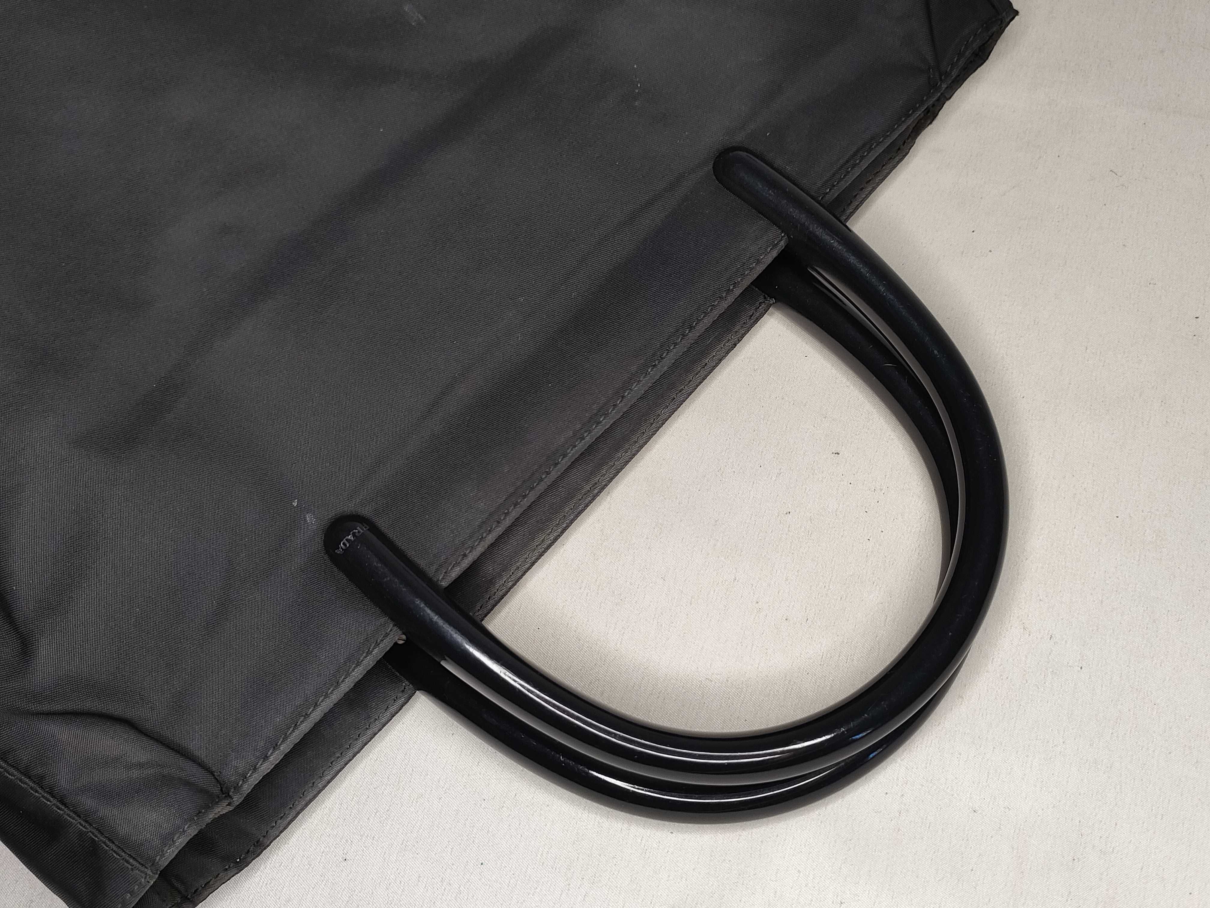 nylon handbag, black, with plastic handle and triangular plate. — view 3