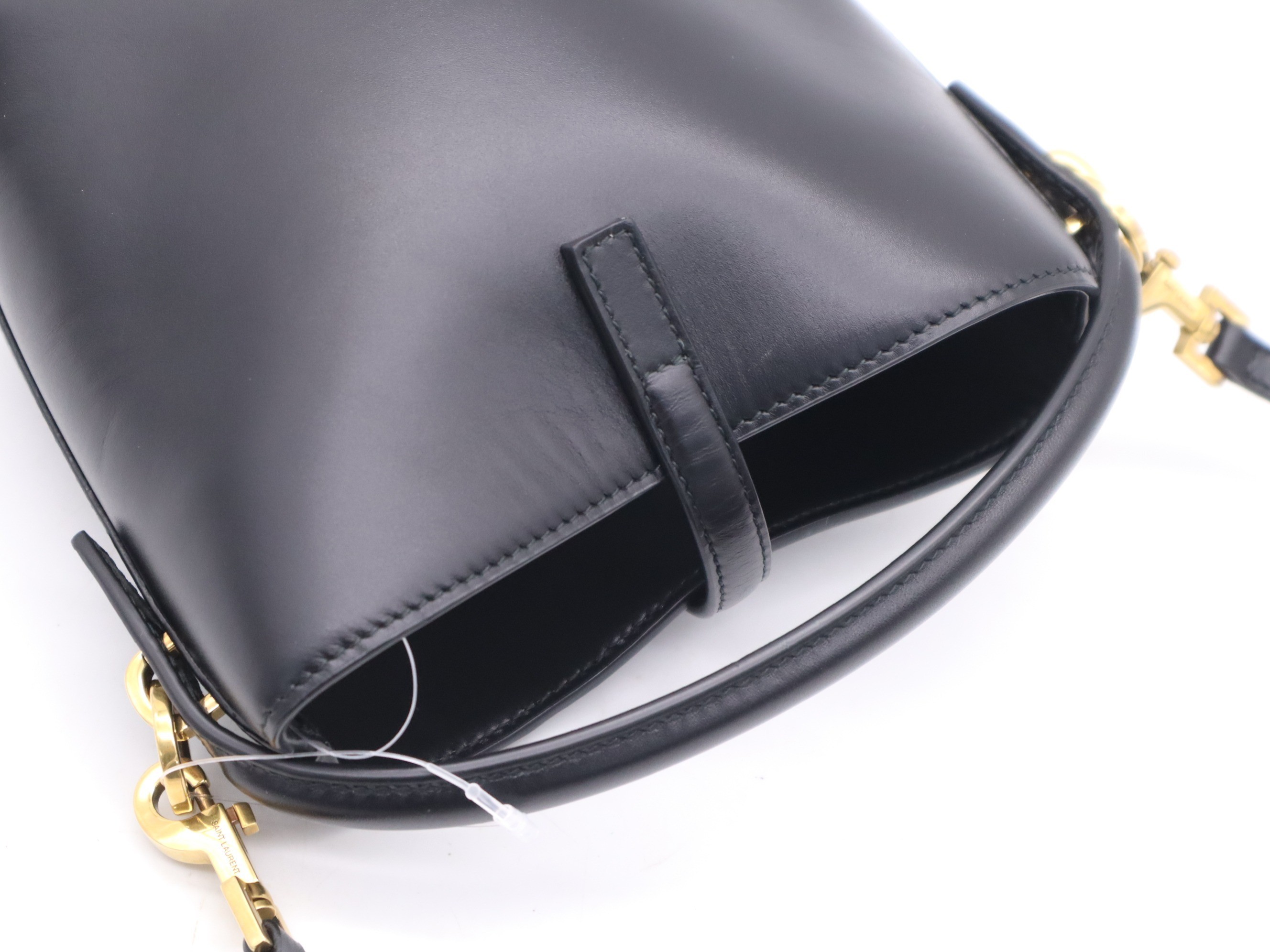Leather YSL logo bucket bag, black, gold hardware, with shoulder strap. — view 6