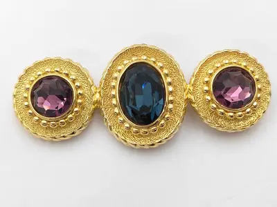 vintage brooch with gold-plated hardware and rhinestones.