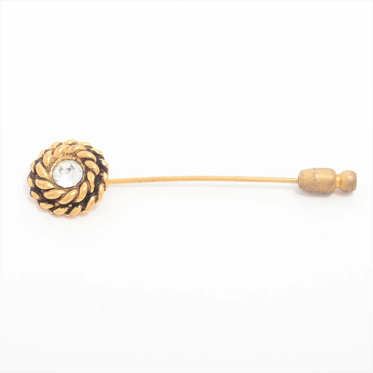 brooch, gold plated with rhinestones. Shows signs of wear, including