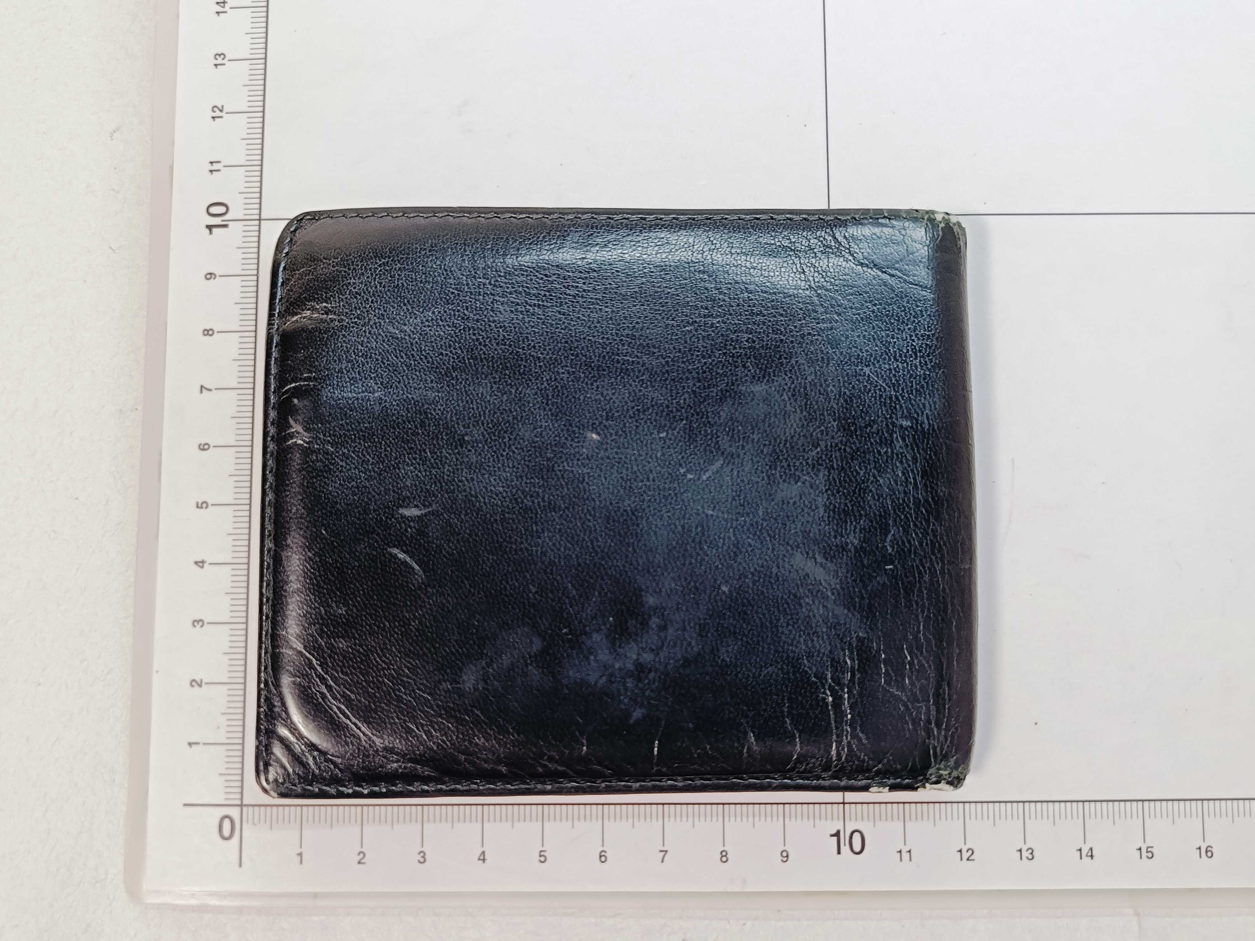 folding wallet, shows signs of wear. — view 2
