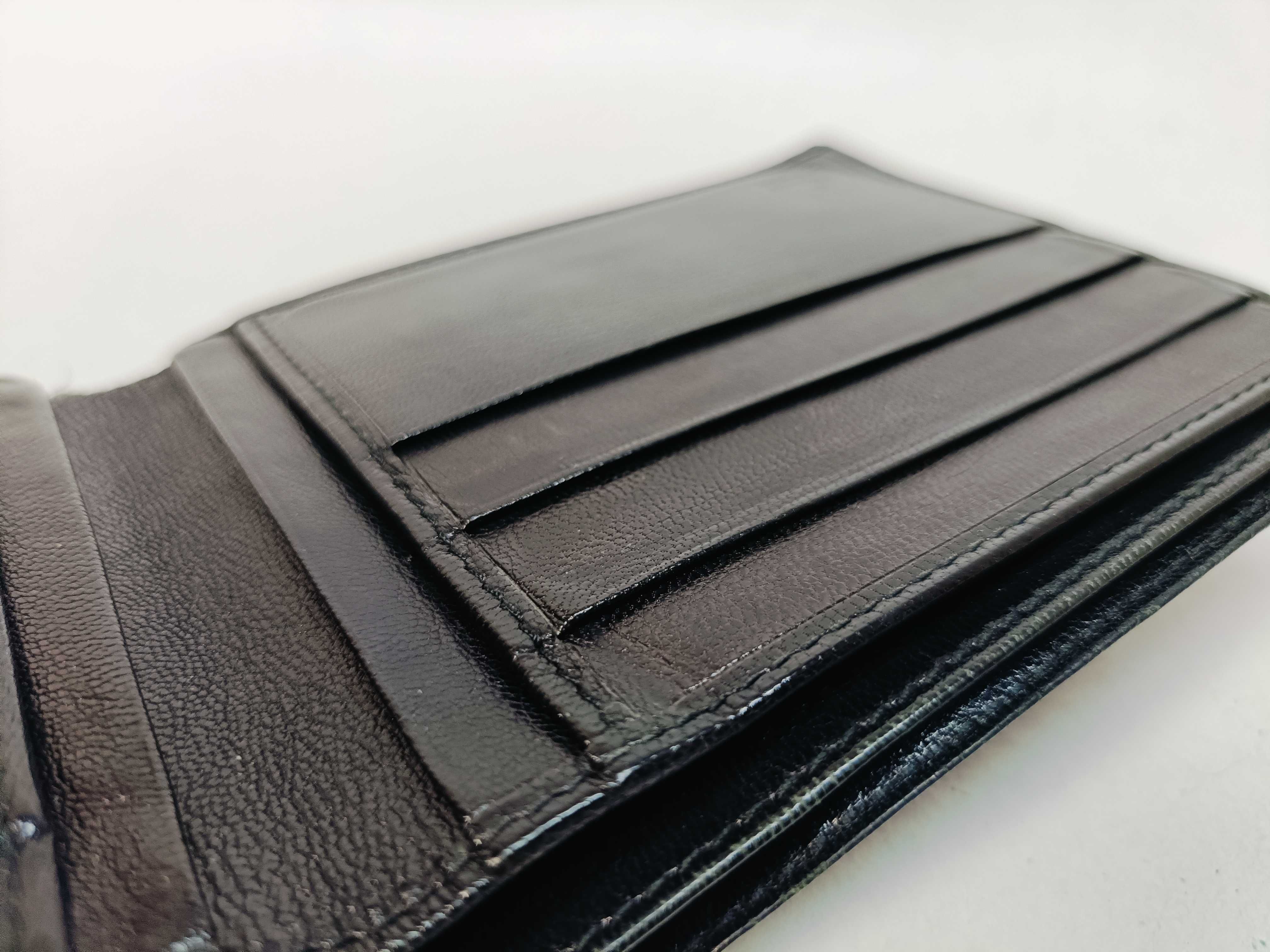 folding wallet, shows signs of wear. — view 11