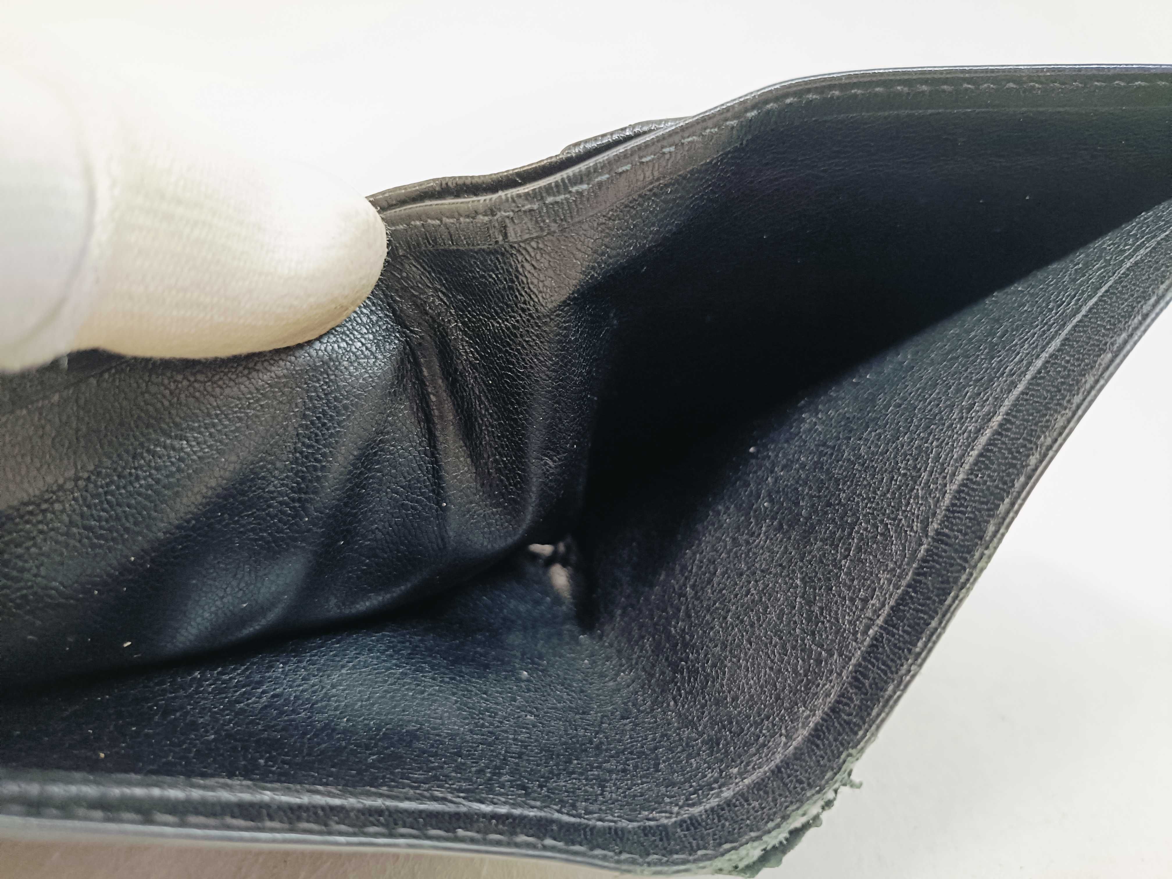 folding wallet, shows signs of wear. — view 13