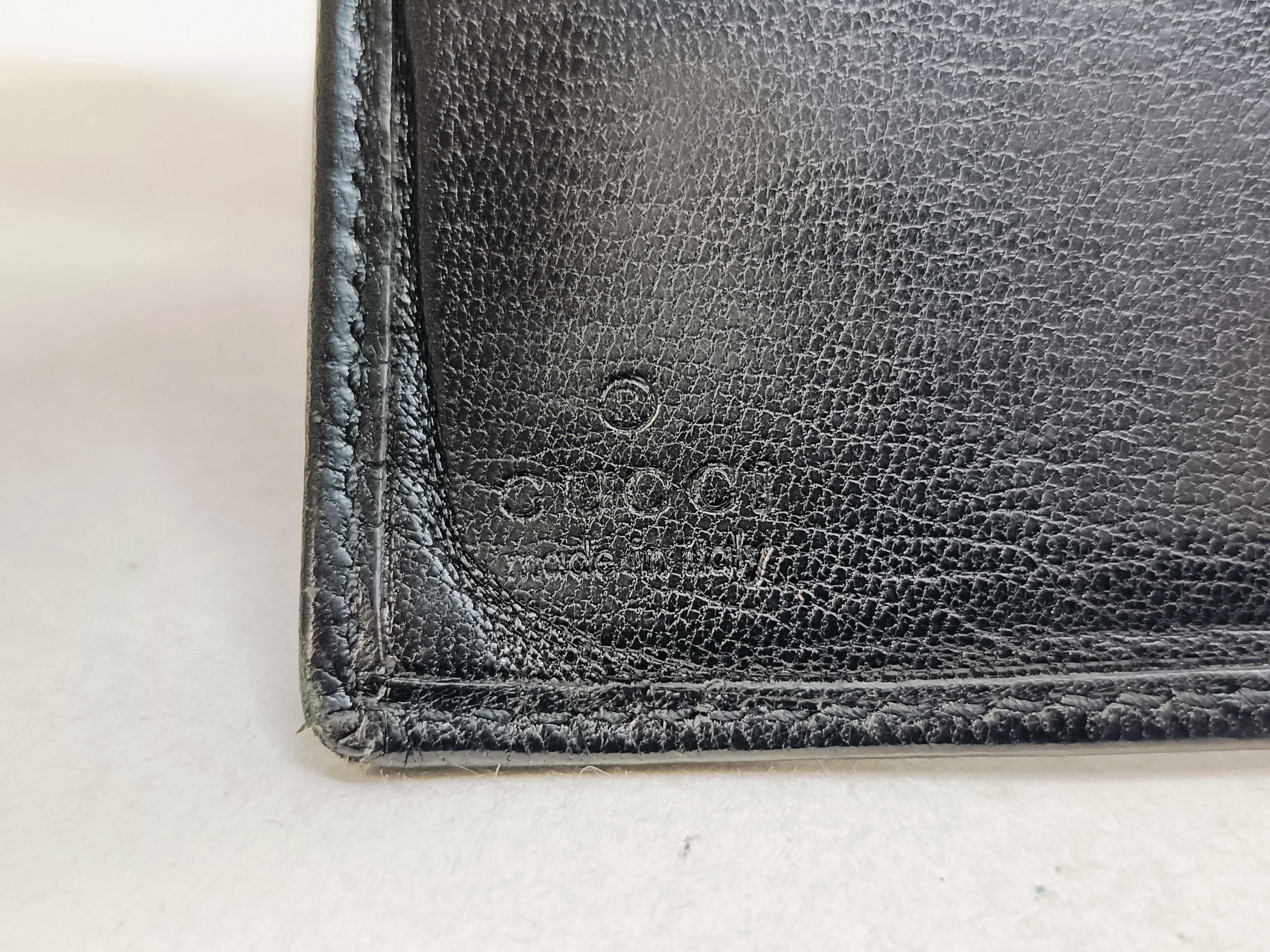 folding wallet, shows signs of wear. — view 14