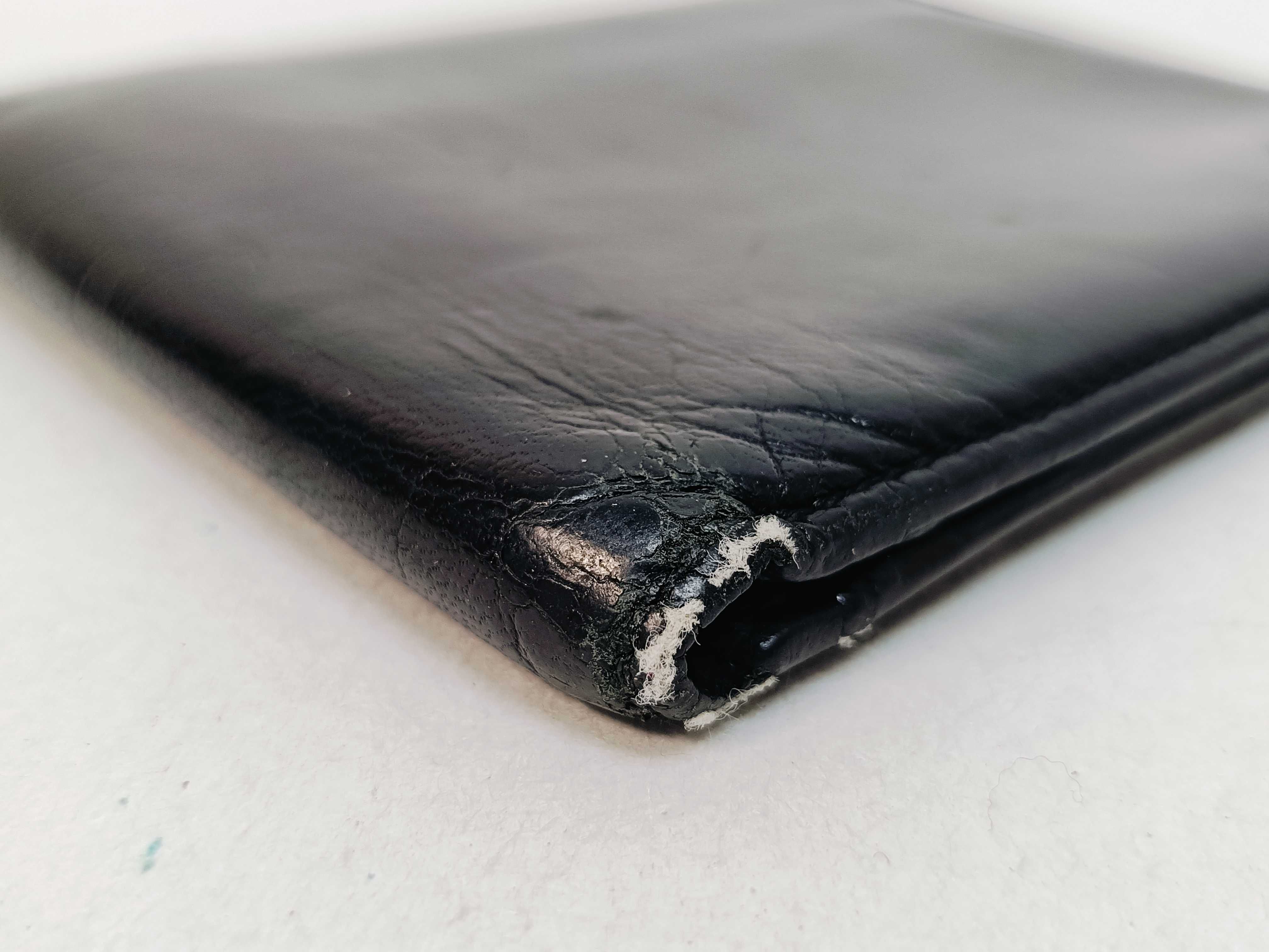 folding wallet, shows signs of wear. — view 4