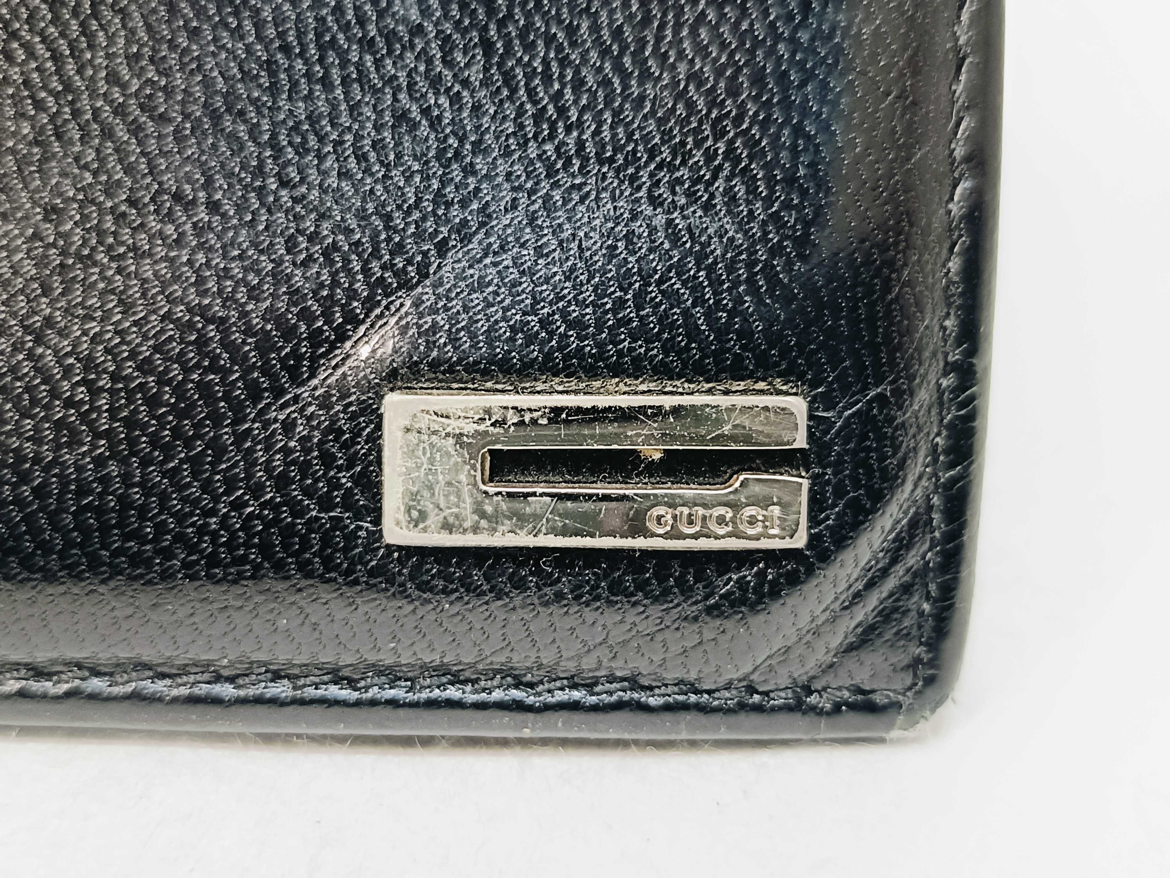 folding wallet, shows signs of wear. — view 7