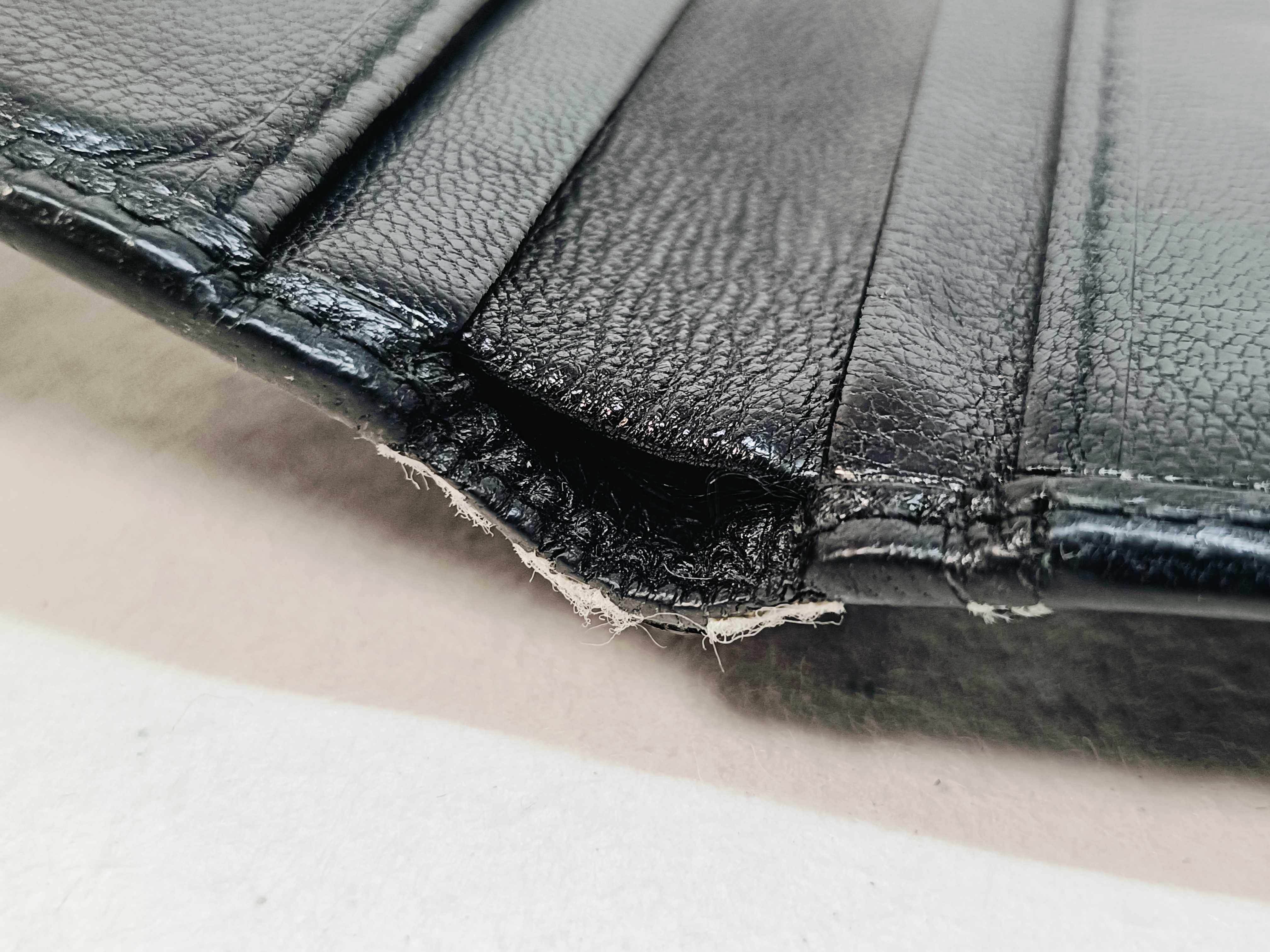 folding wallet, shows signs of wear. — view 9
