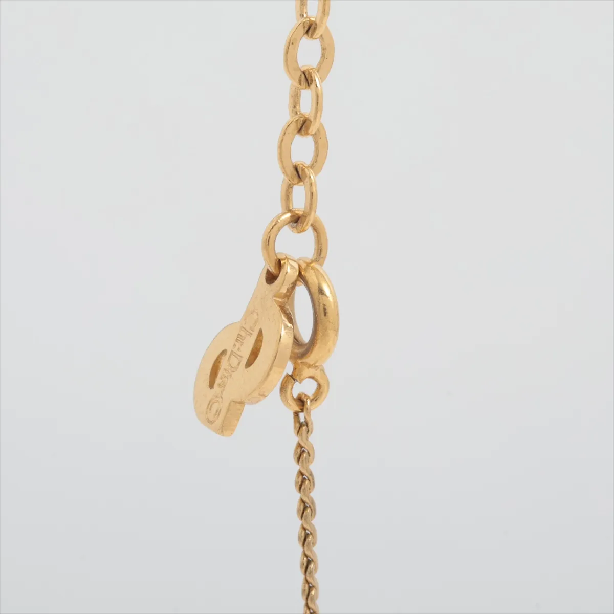 CD logo necklace, gold-plated with rhinestones. Shows signs of wear, — view 3