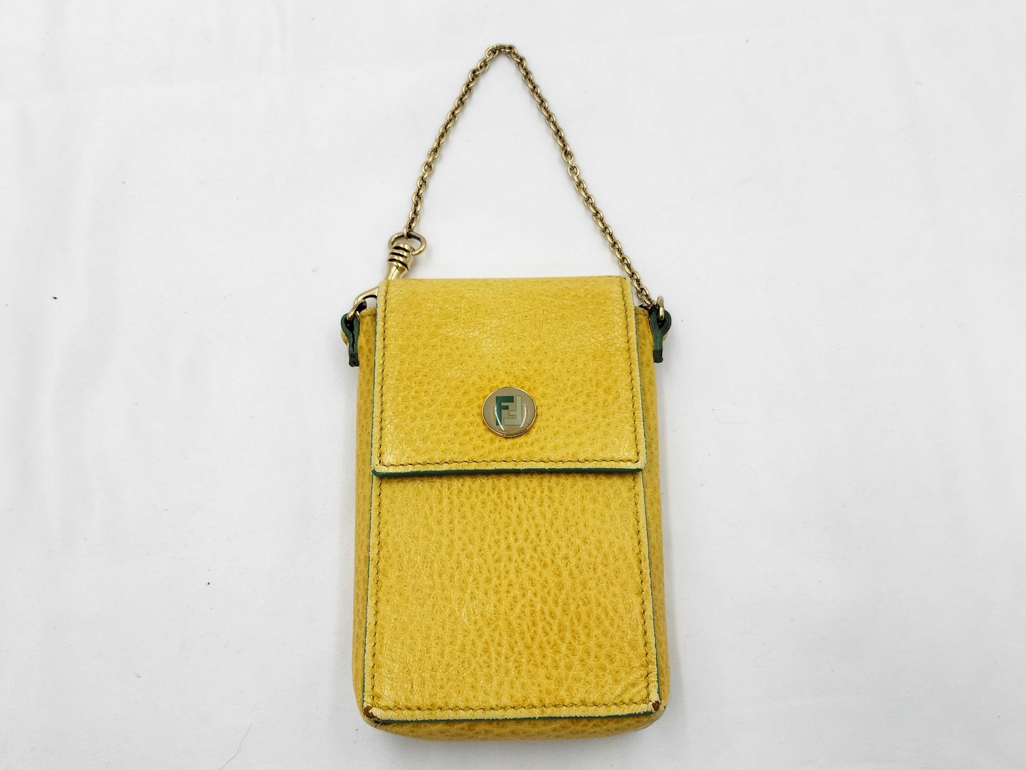 FF logo phone pouch, yellow, significant wear on the logo.