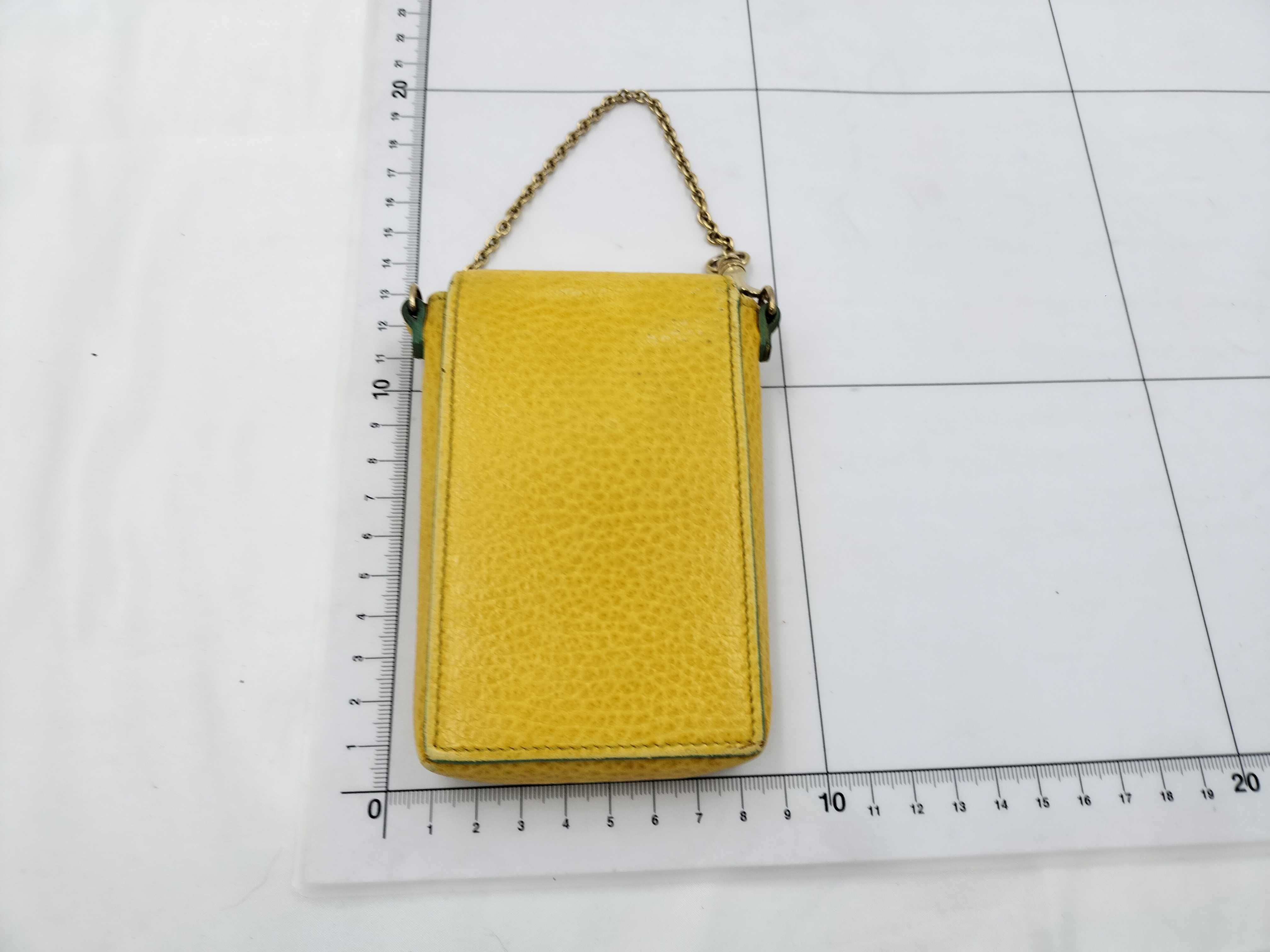 FF logo phone pouch, yellow, significant wear on the logo. — view 2