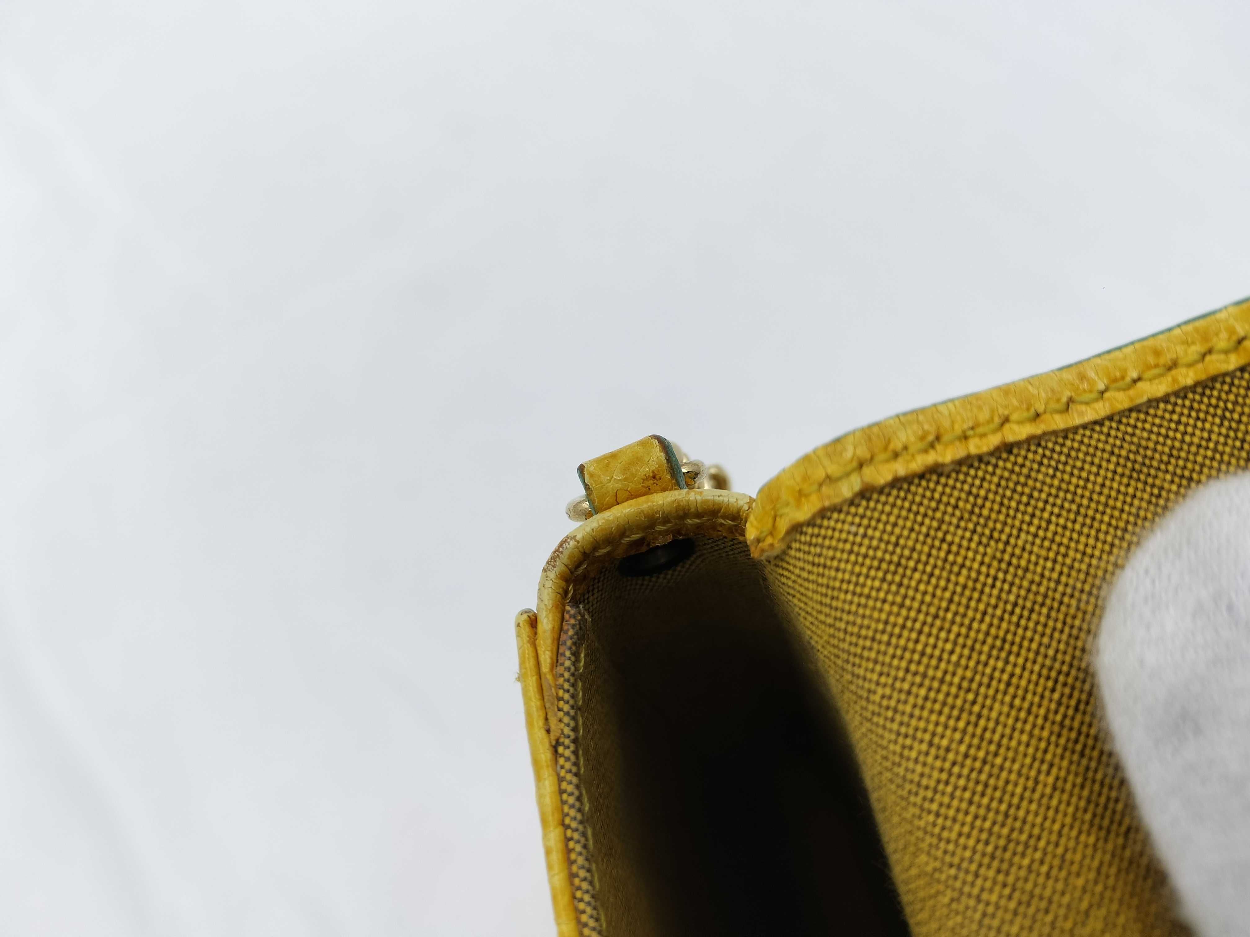 FF logo phone pouch, yellow, significant wear on the logo. — view 11