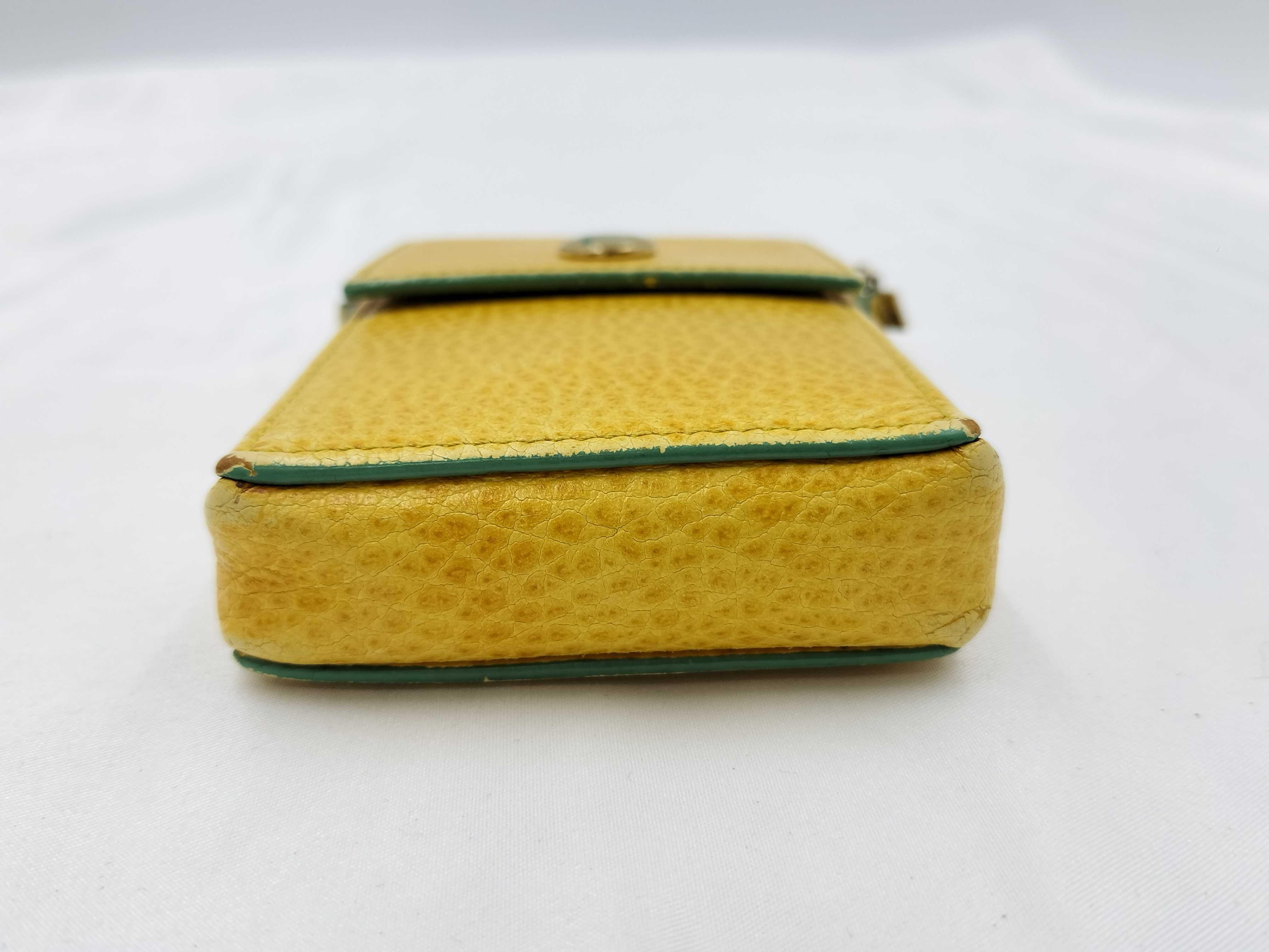 FF logo phone pouch, yellow, significant wear on the logo. — view 3