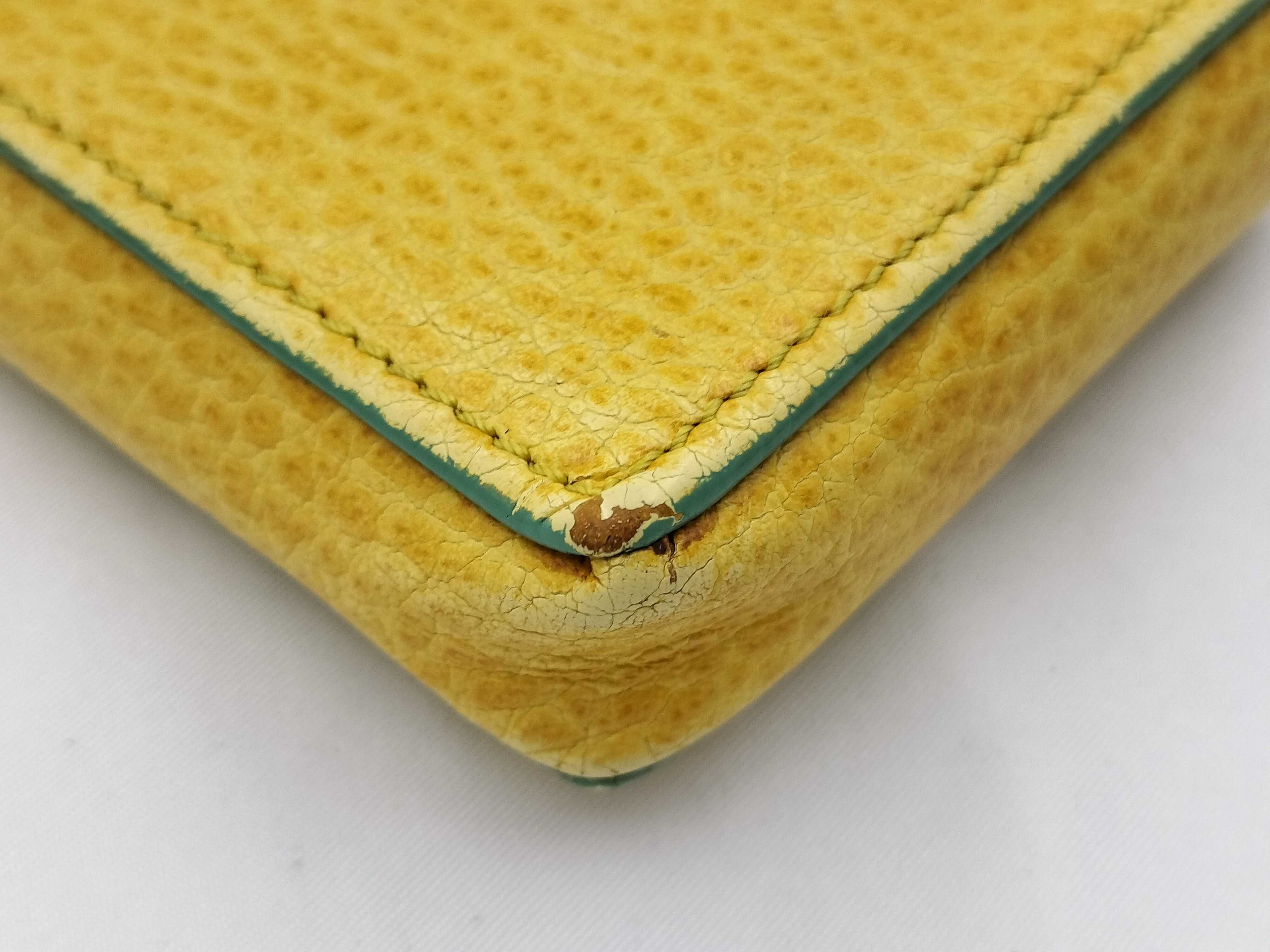 FF logo phone pouch, yellow, significant wear on the logo. — view 4