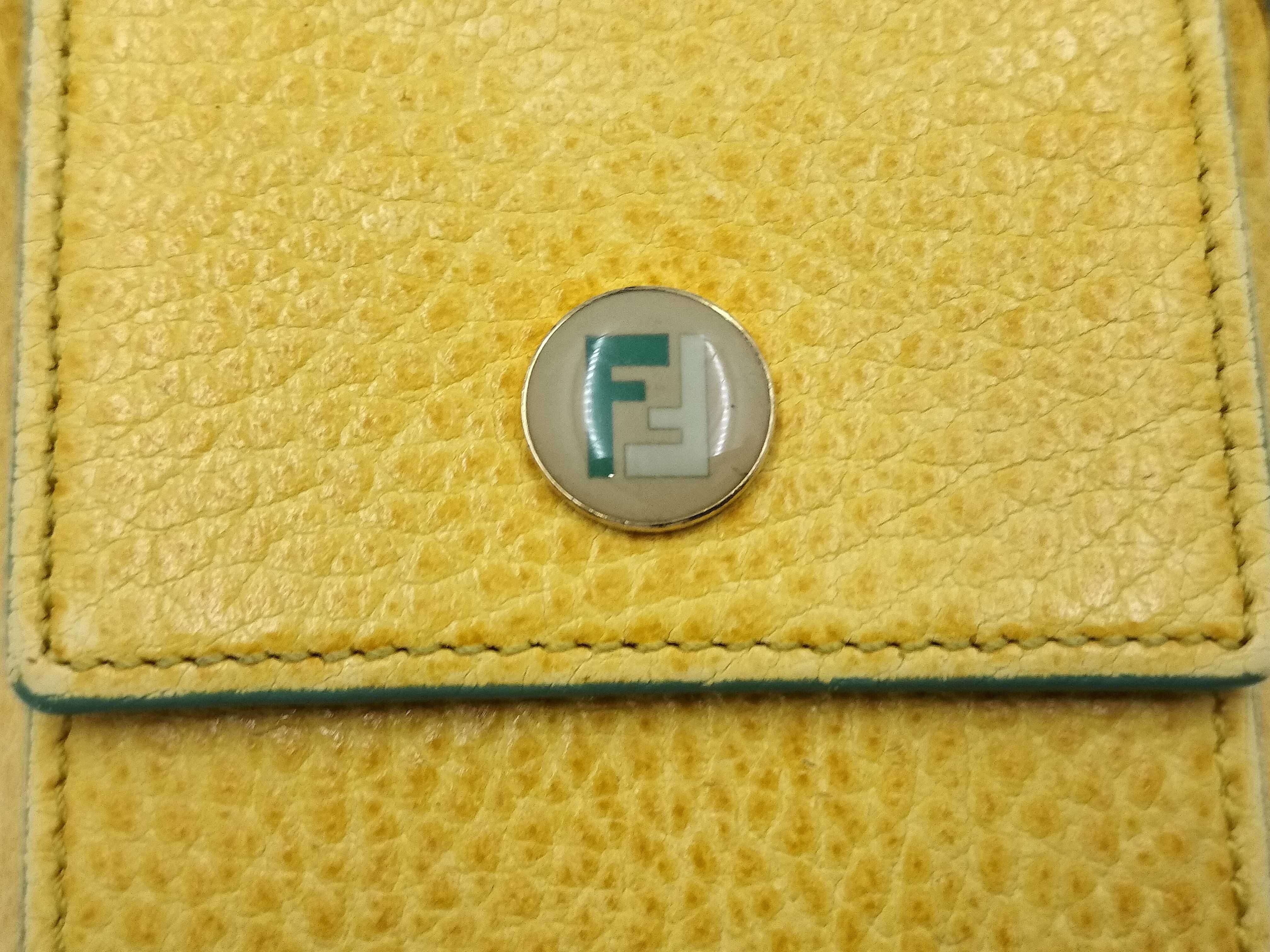 FF logo phone pouch, yellow, significant wear on the logo. — view 5