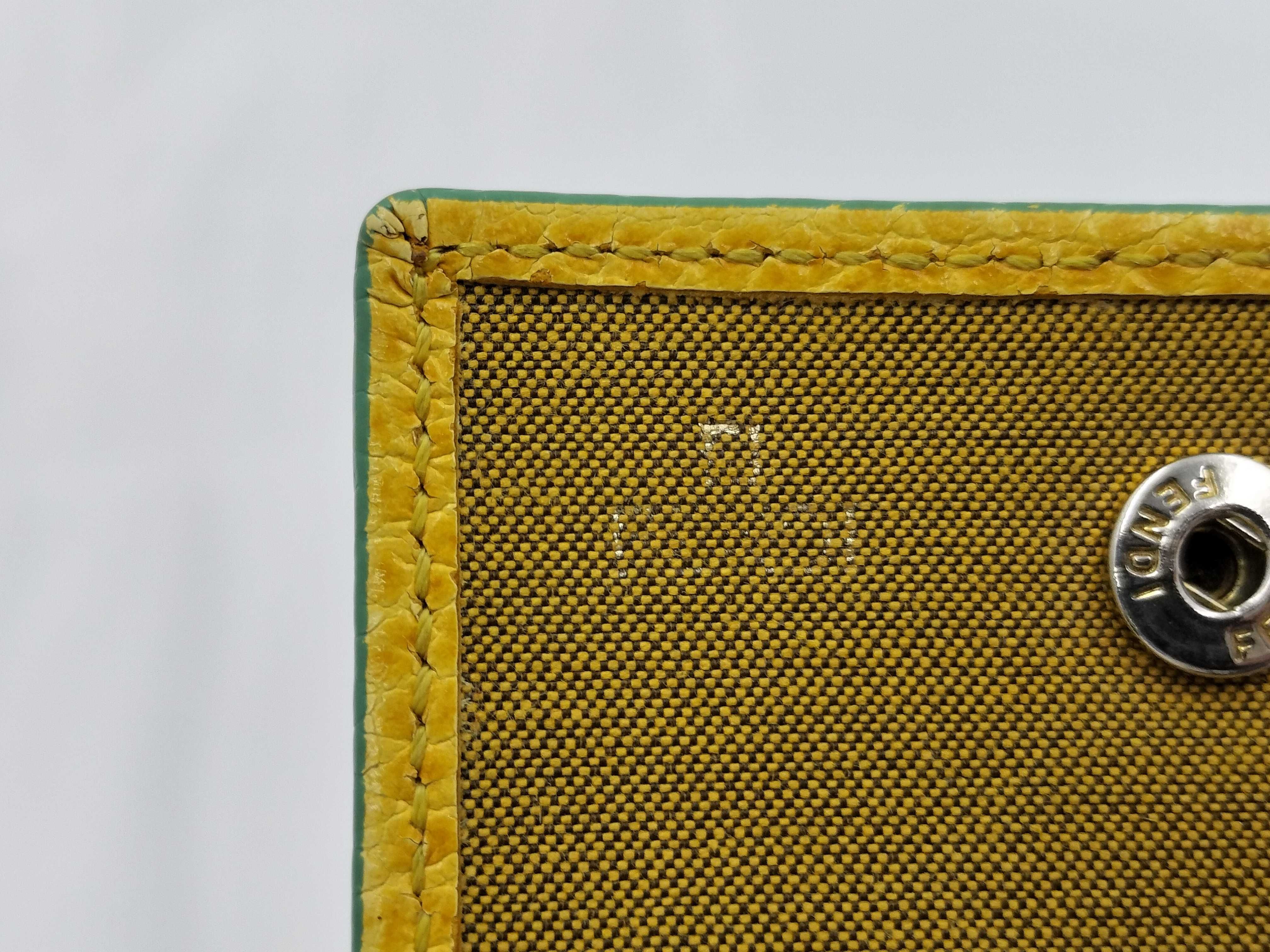 FF logo phone pouch, yellow, significant wear on the logo. — view 9