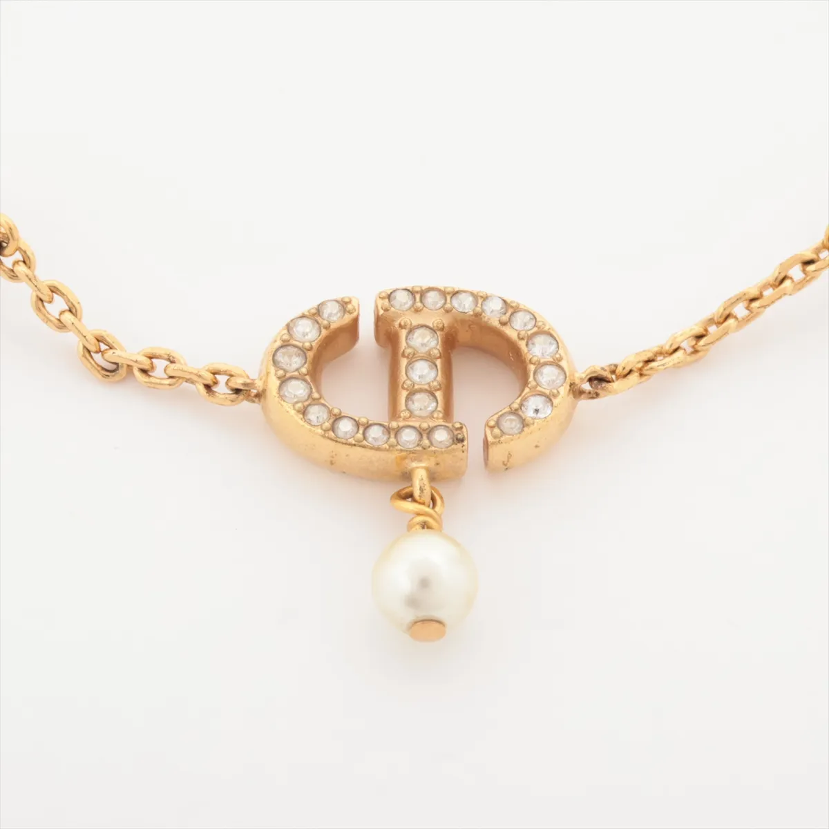 Petit CD bracelet, gold-plated with rhinestones and faux pearls. Shows signs of wear, including — view 2